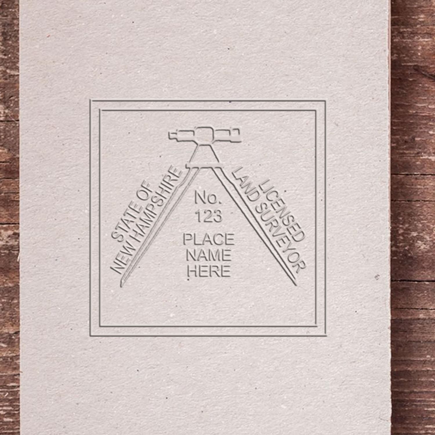 A stamped impression of the Handheld New Hampshire Land Surveyor Seal in this stylish lifestyle photo, setting the tone for a unique and personalized product.