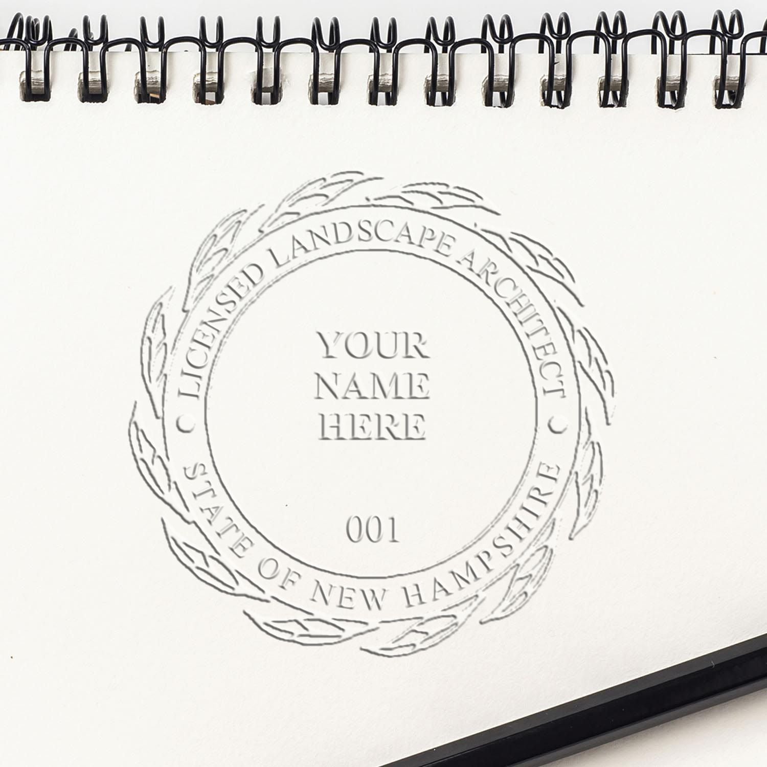 A stamped impression of the State of New Hampshire Extended Long Reach Landscape Architect Seal Embosser in this stylish lifestyle photo, setting the tone for a unique and personalized product.