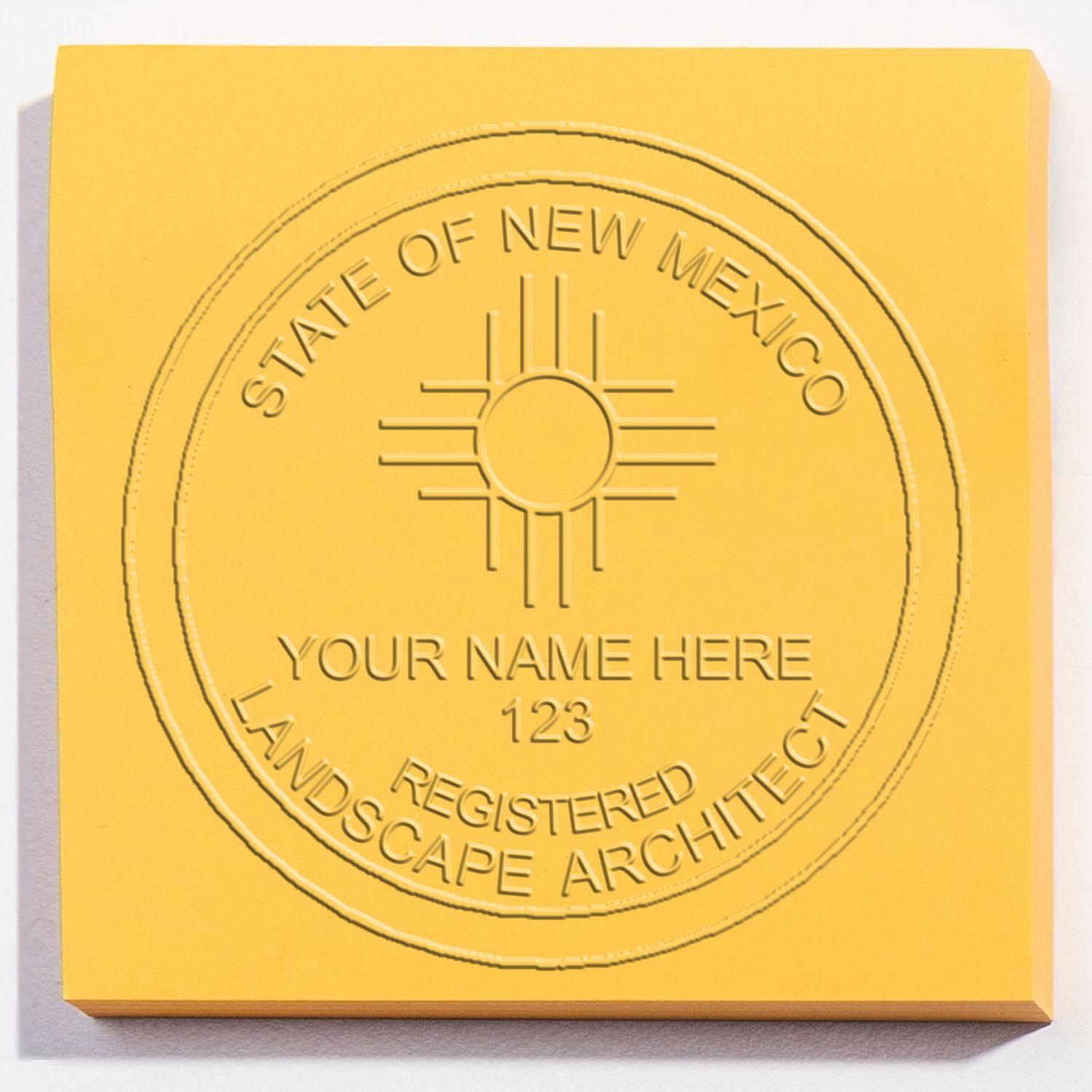 An alternative view of the New Mexico Long Reach Landscape Architect Embossing Stamp stamped on a sheet of paper showing the image in use