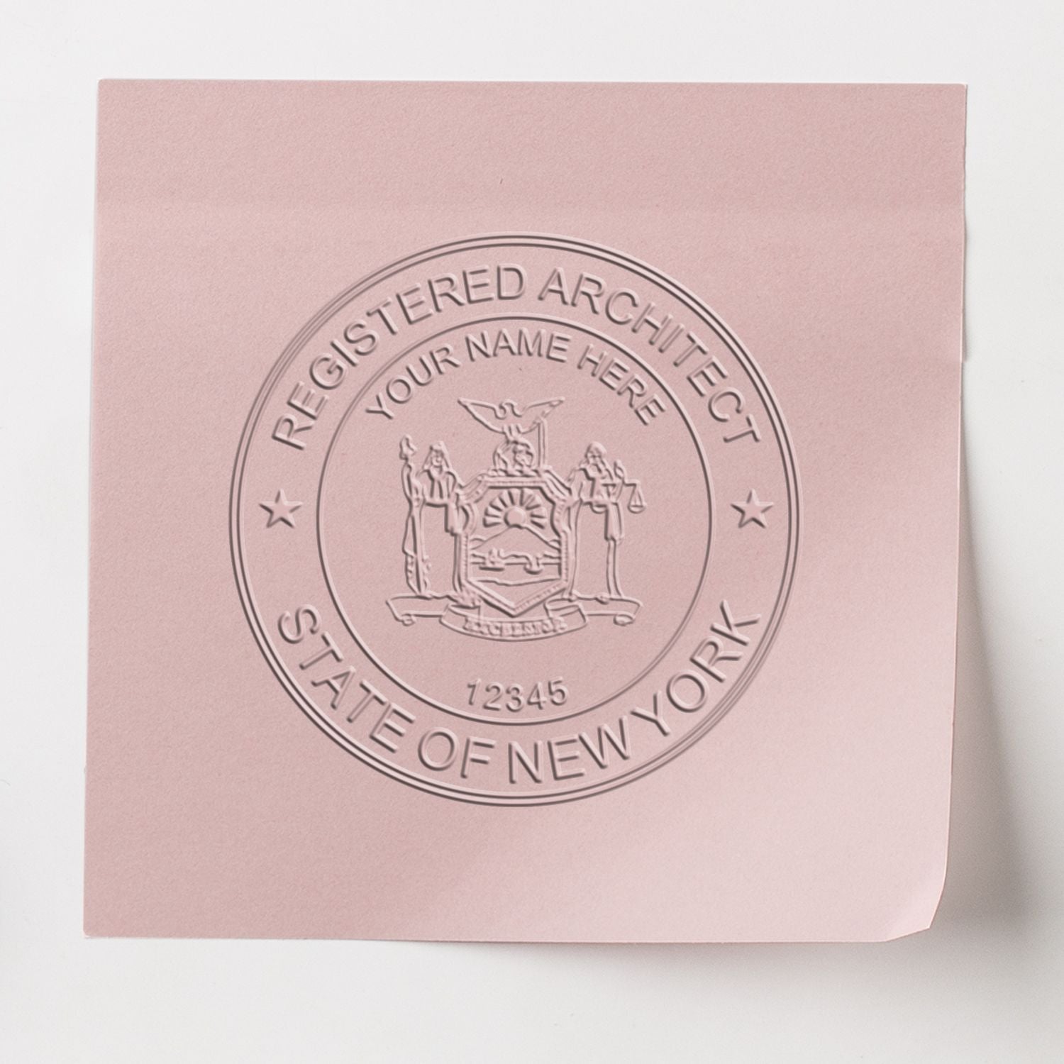 This paper is stamped with a sample imprint of the Handheld New York Architect Seal Embosser, signifying its quality and reliability.