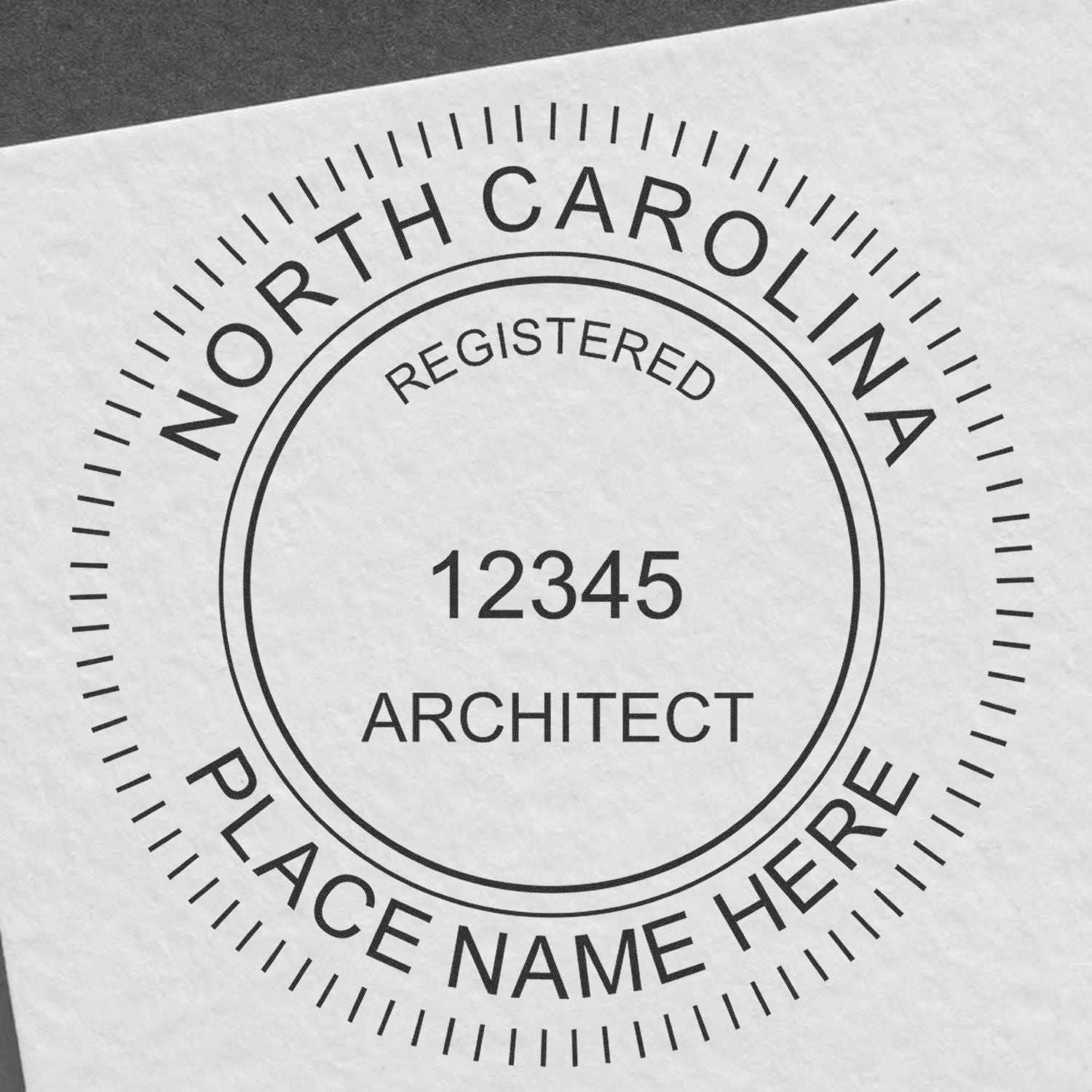 Premium MaxLight Pre-Inked North Carolina Architectural Stamp with customizable text fields for registration number and place name.