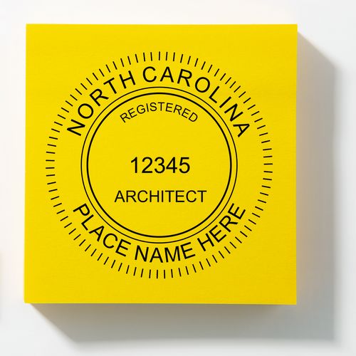 Self Inking North Carolina Architect Stamp on a yellow background, displaying a customizable seal with North Carolina Registered Architect text.