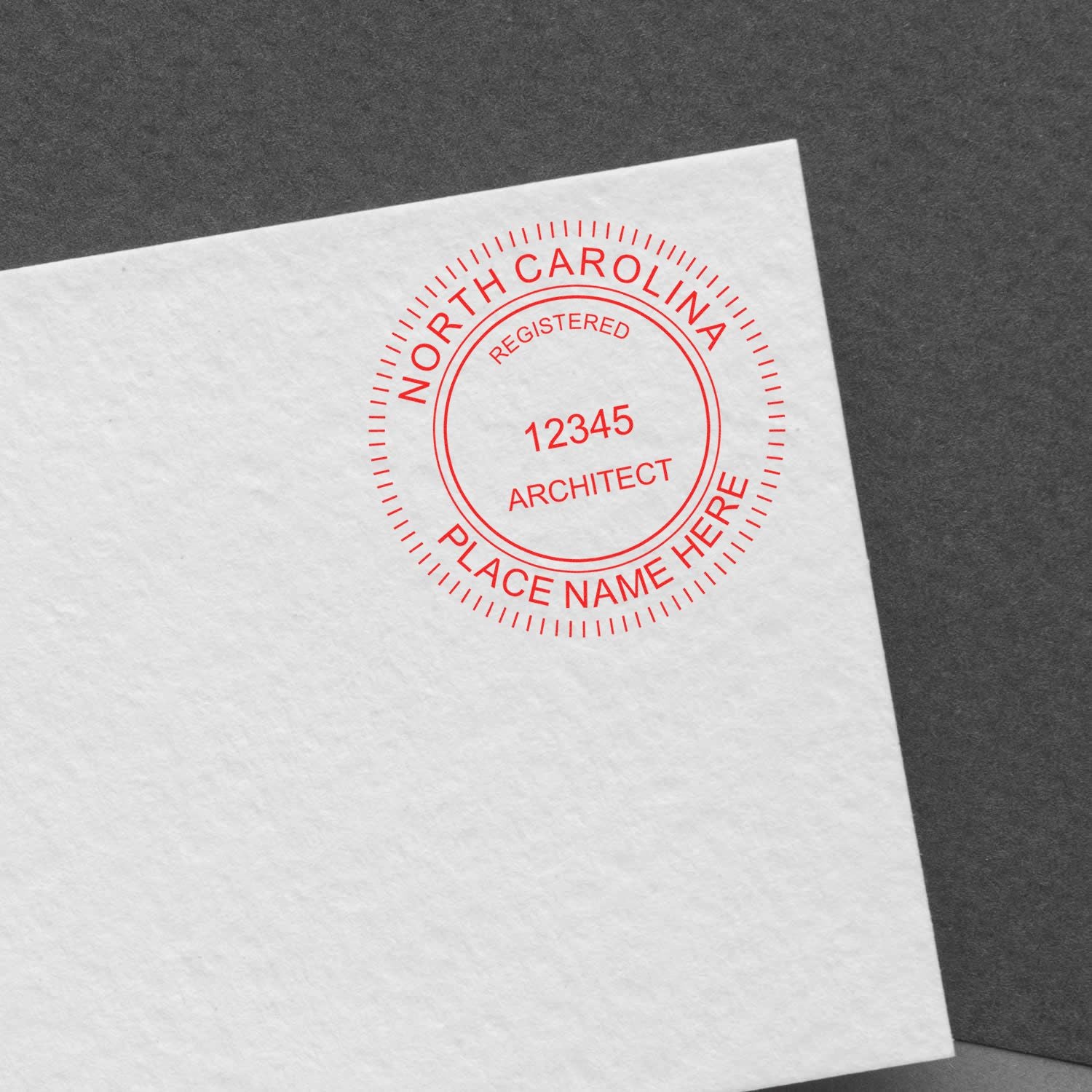 Premium MaxLight Pre-Inked North Carolina Architectural Stamp in red ink on white paper, displaying registration number and place name.