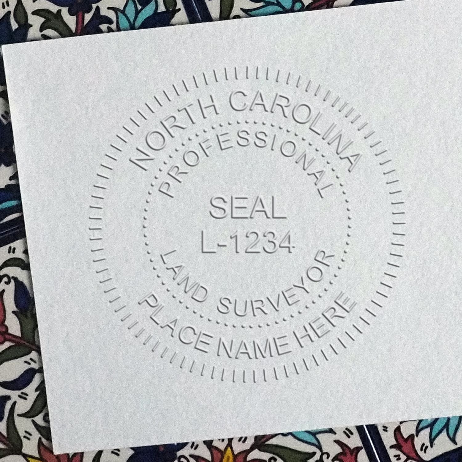 The Long Reach North Carolina Land Surveyor Seal stamp impression comes to life with a crisp, detailed photo on paper - showcasing true professional quality.