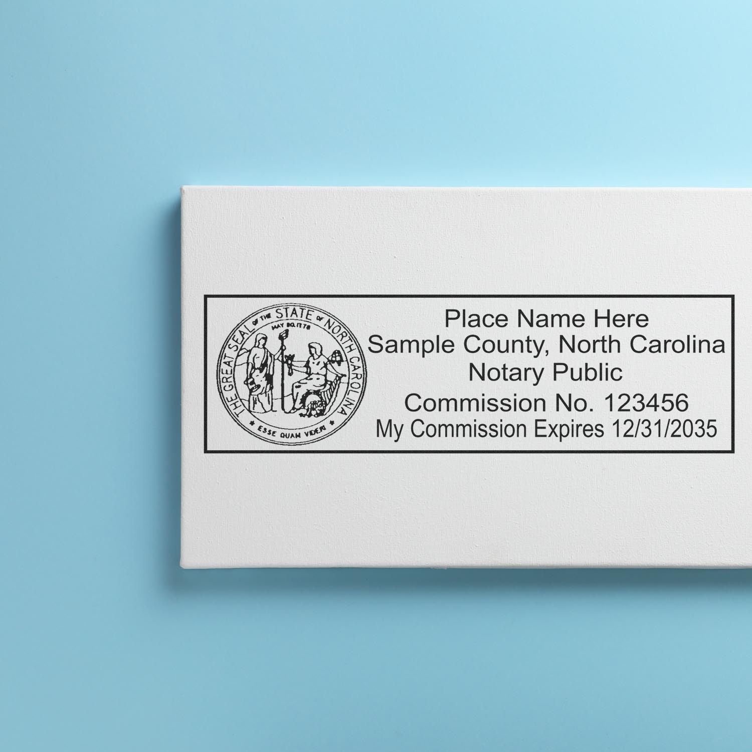 A lifestyle photo showing a stamped image of the MaxLight Premium Pre-Inked North Carolina State Seal Notarial Stamp on a piece of paper