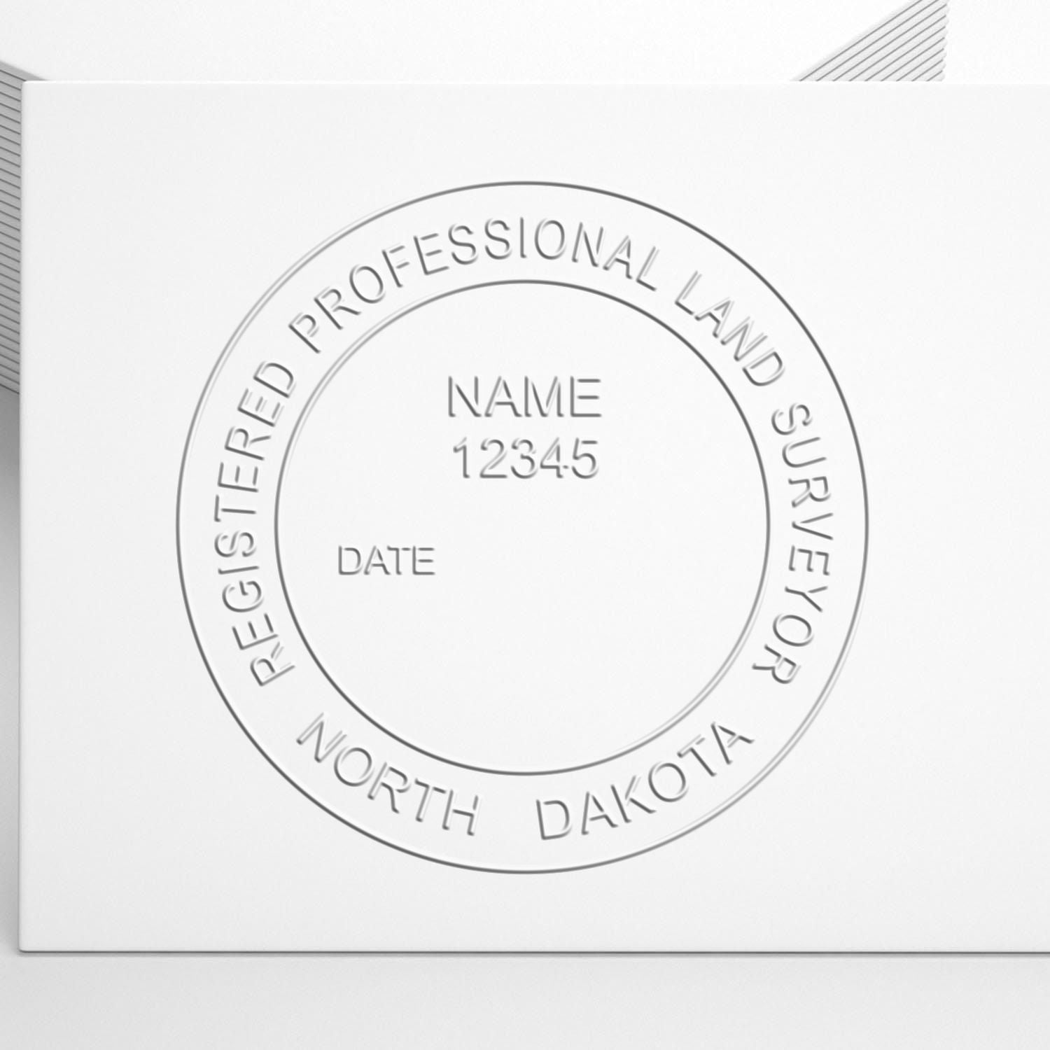 The Long Reach North Dakota Land Surveyor Seal stamp impression comes to life with a crisp, detailed photo on paper - showcasing true professional quality.