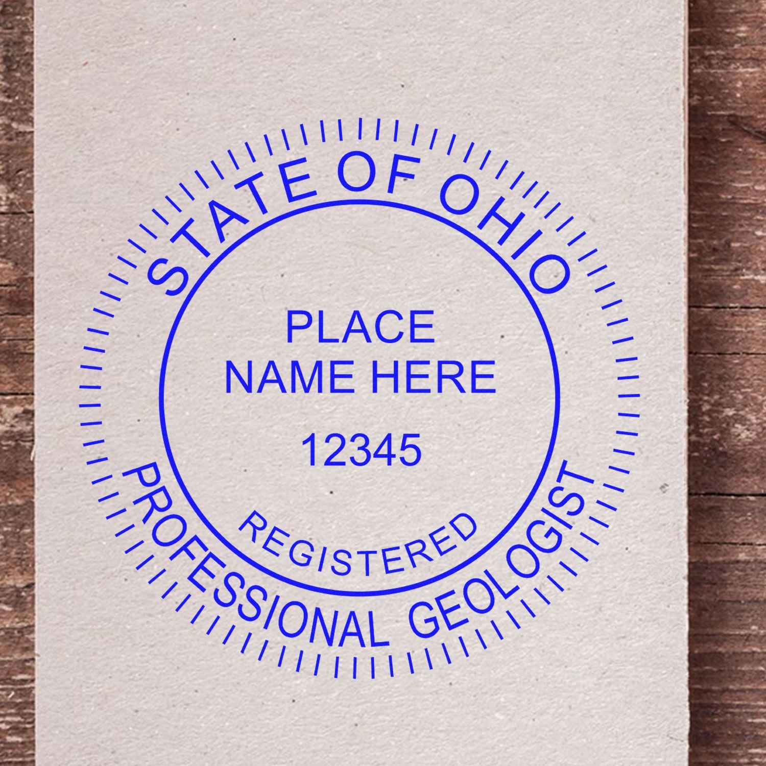 An alternative view of the Self-Inking Ohio Geologist Stamp stamped on a sheet of paper showing the image in use