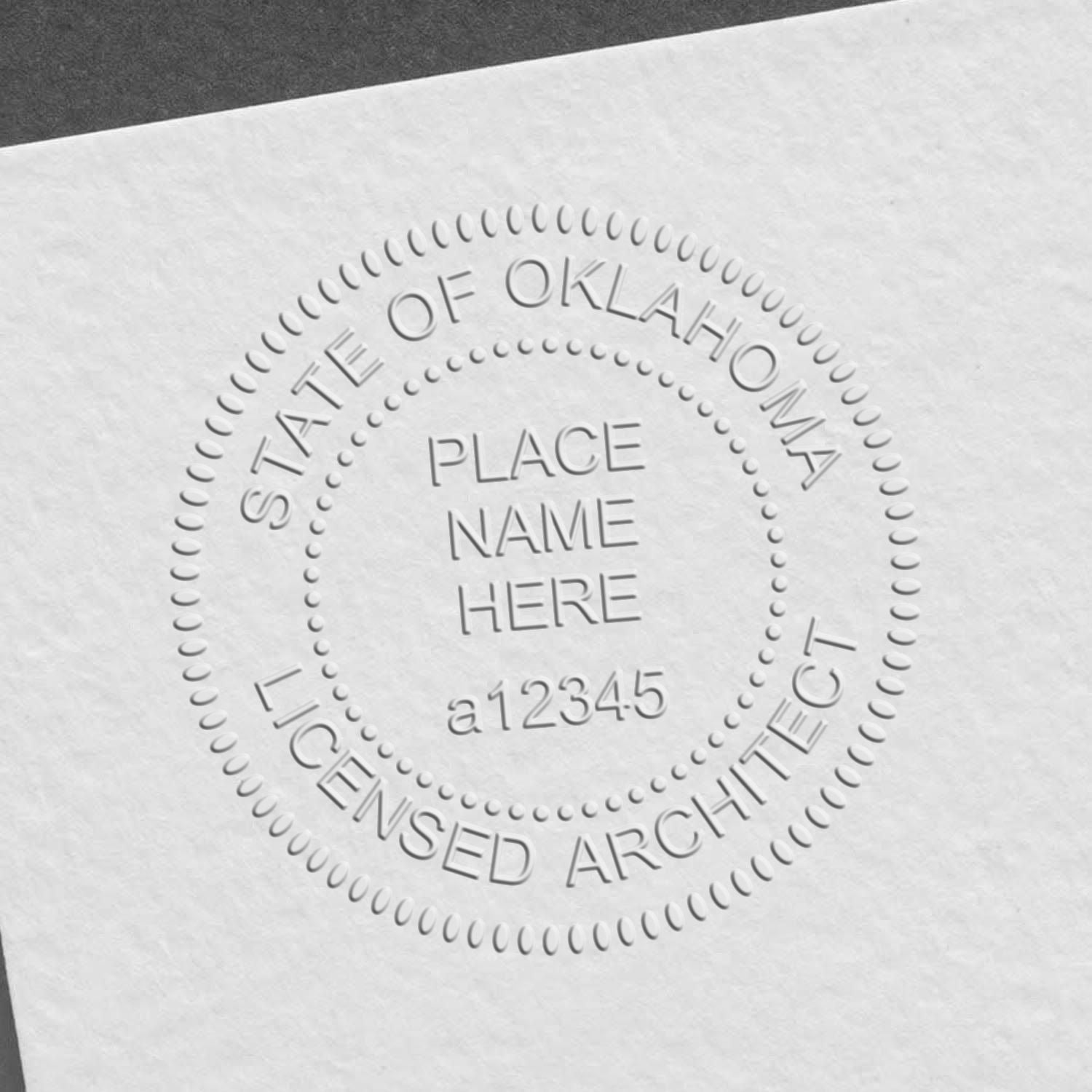 A lifestyle photo showing a stamped image of the Oklahoma Desk Architect Embossing Seal on a piece of paper