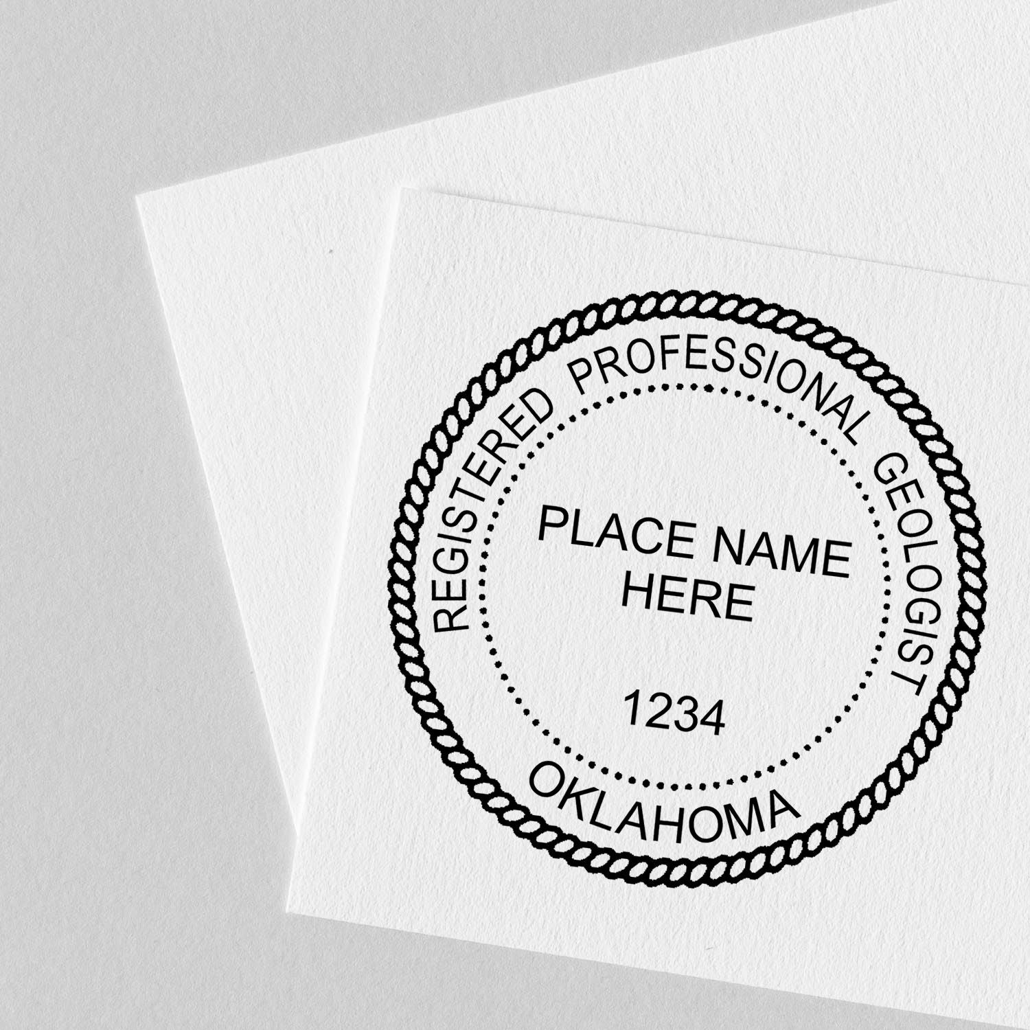 A lifestyle photo showing a stamped image of the Slim Pre-Inked Oklahoma Professional Geologist Seal Stamp on a piece of paper
