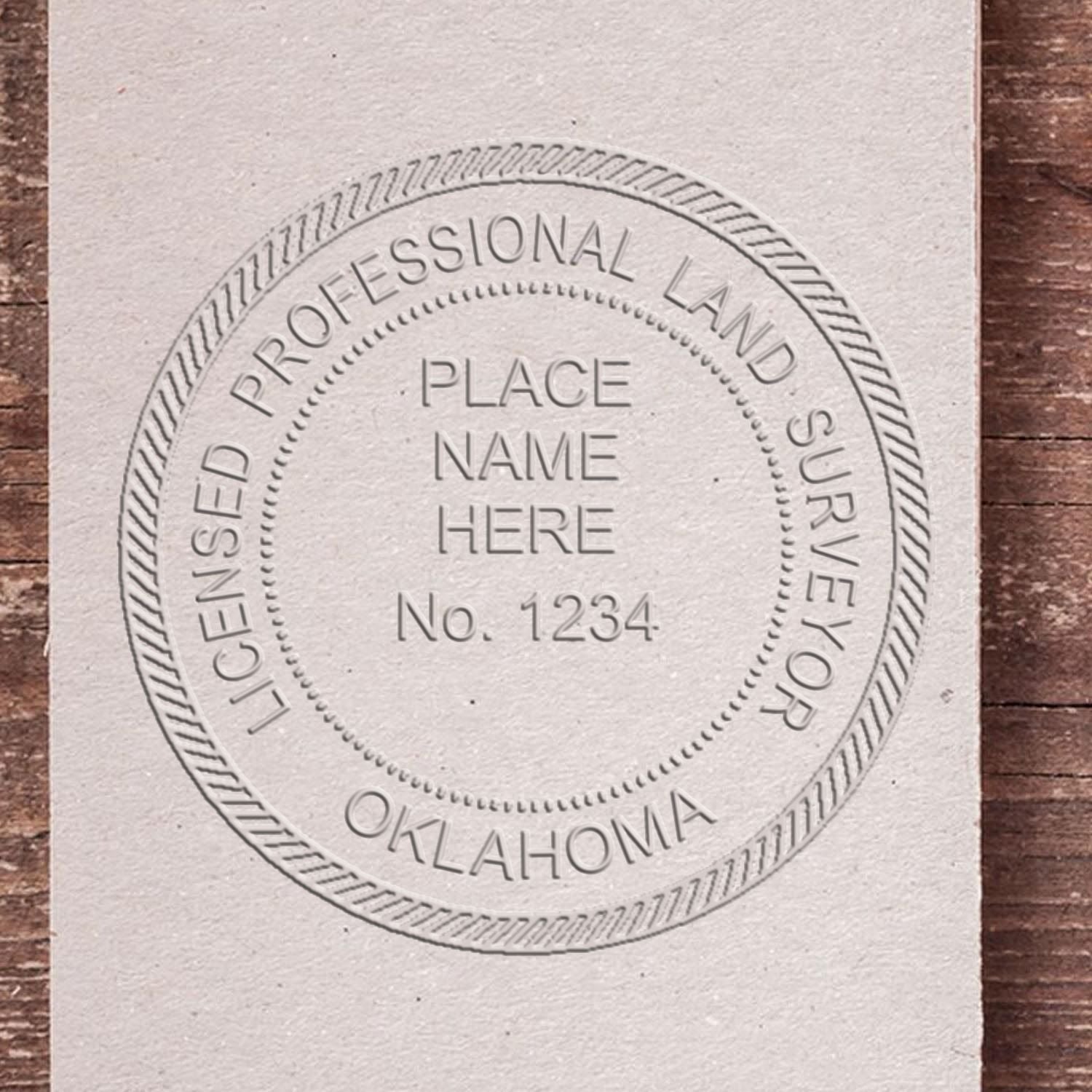 A stamped impression of the Extended Long Reach Oklahoma Surveyor Embosser in this stylish lifestyle photo, setting the tone for a unique and personalized product.