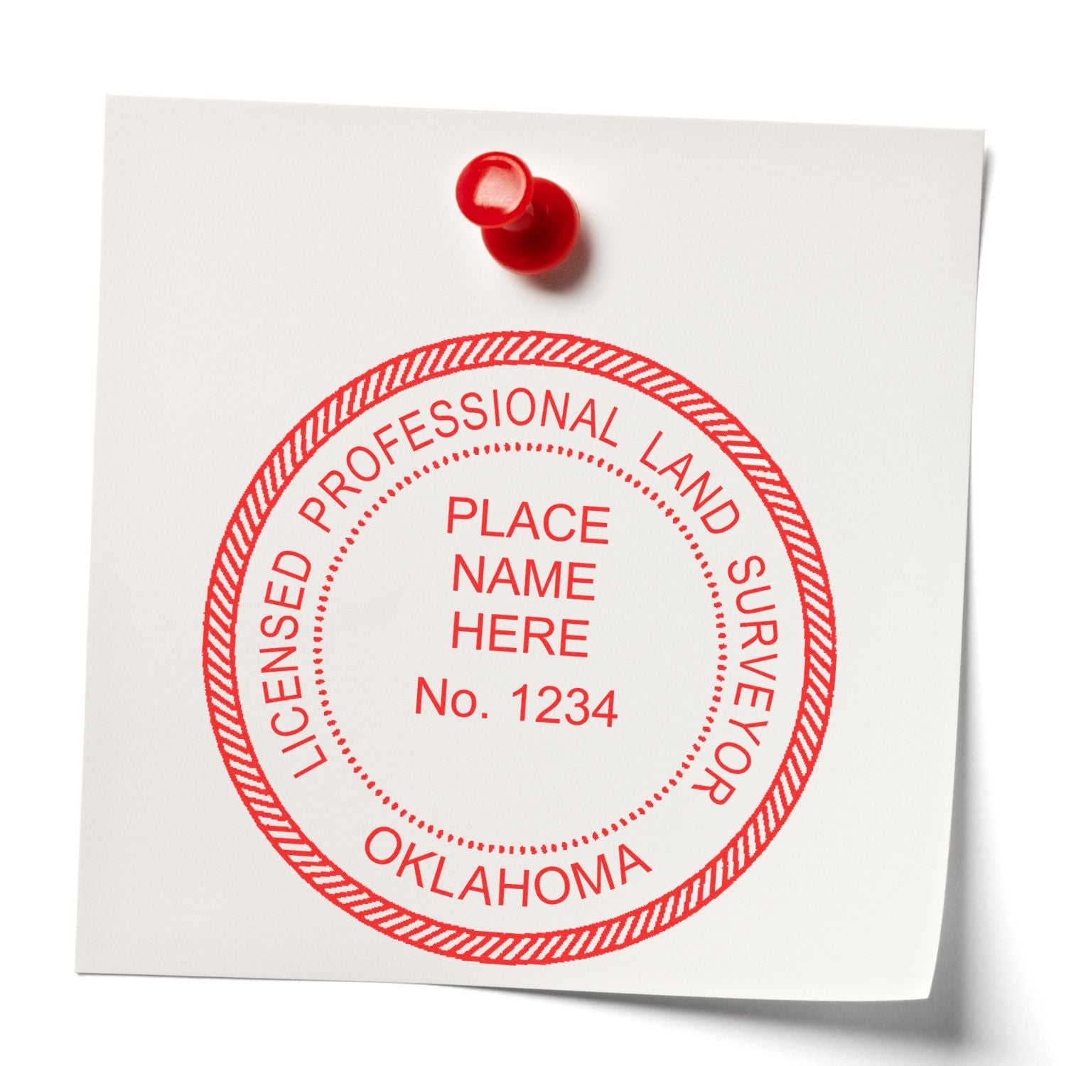 Premium MaxLight Pre-Inked Oklahoma Surveyors Stamp in red ink on a white paper pinned to a board.