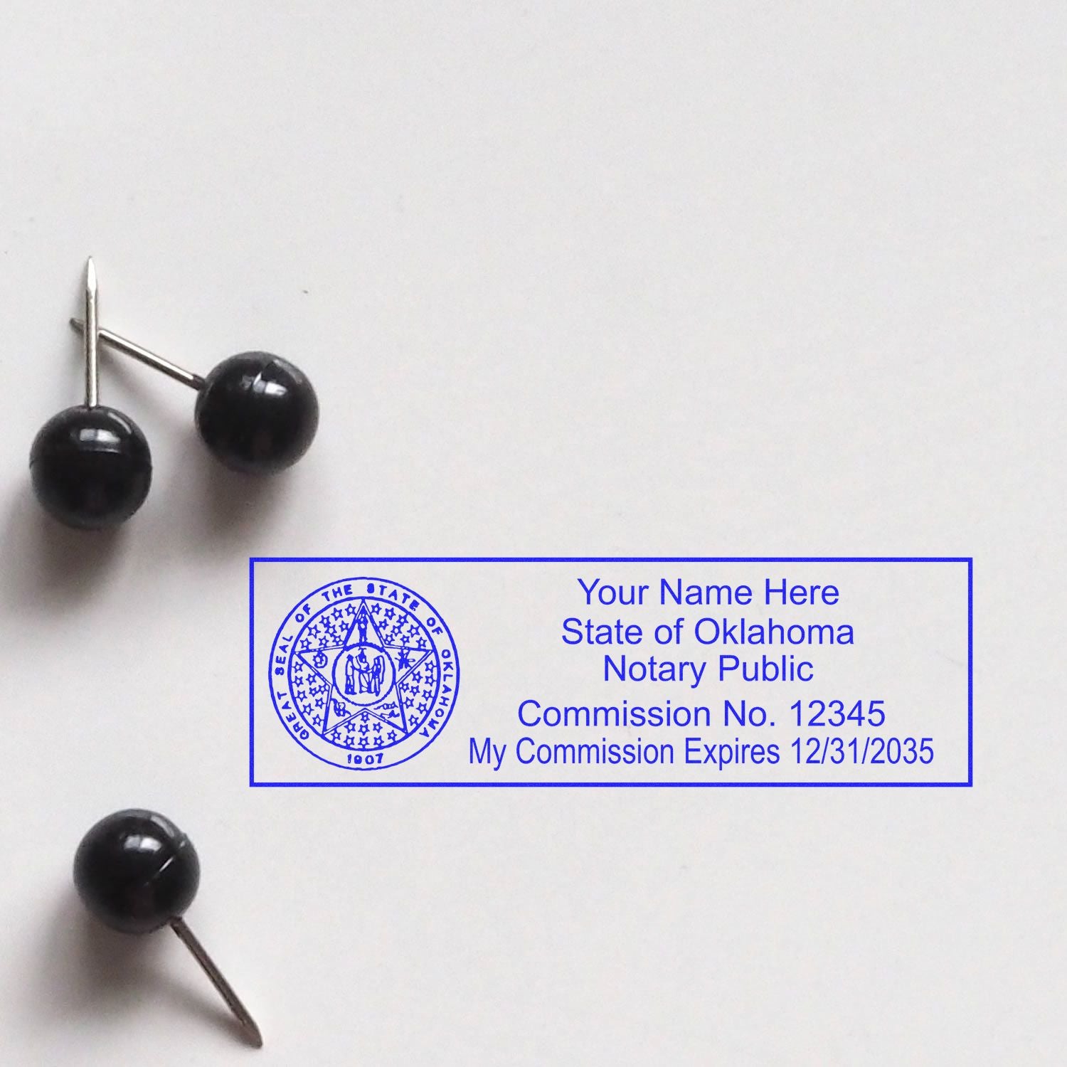 This paper is stamped with a sample imprint of the Slim Pre-Inked State Seal Notary Stamp for Oklahoma, signifying its quality and reliability.
