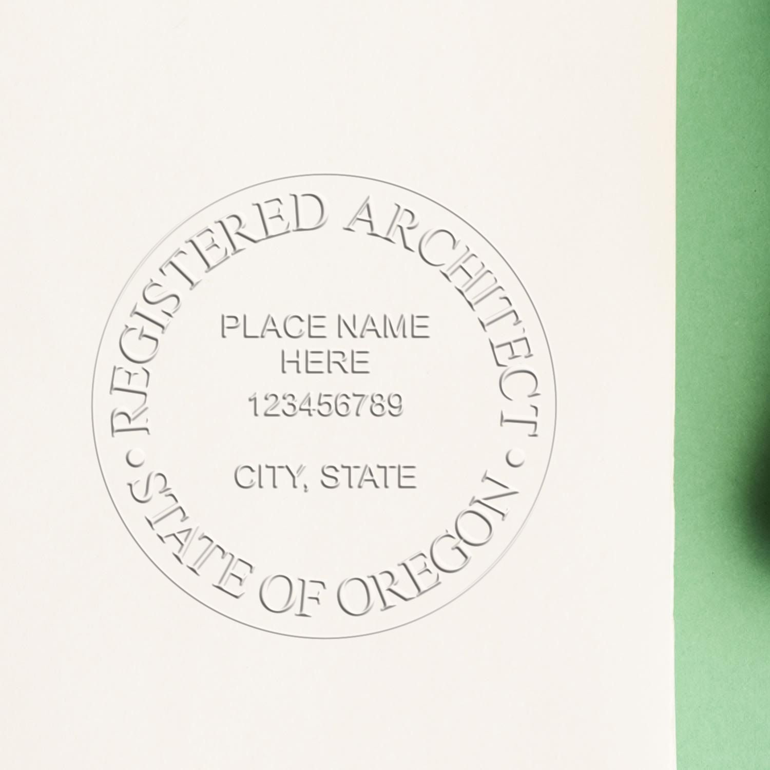 A lifestyle photo showing a stamped image of the Oregon Desk Architect Embossing Seal on a piece of paper