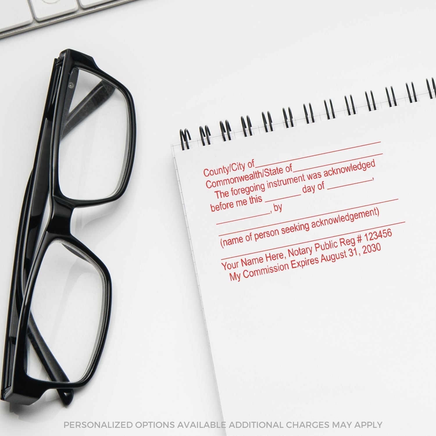 Notary Acknowledgment Stamp in use on a notepad next to a pair of black glasses. The stamp includes customizable fields for notary details.