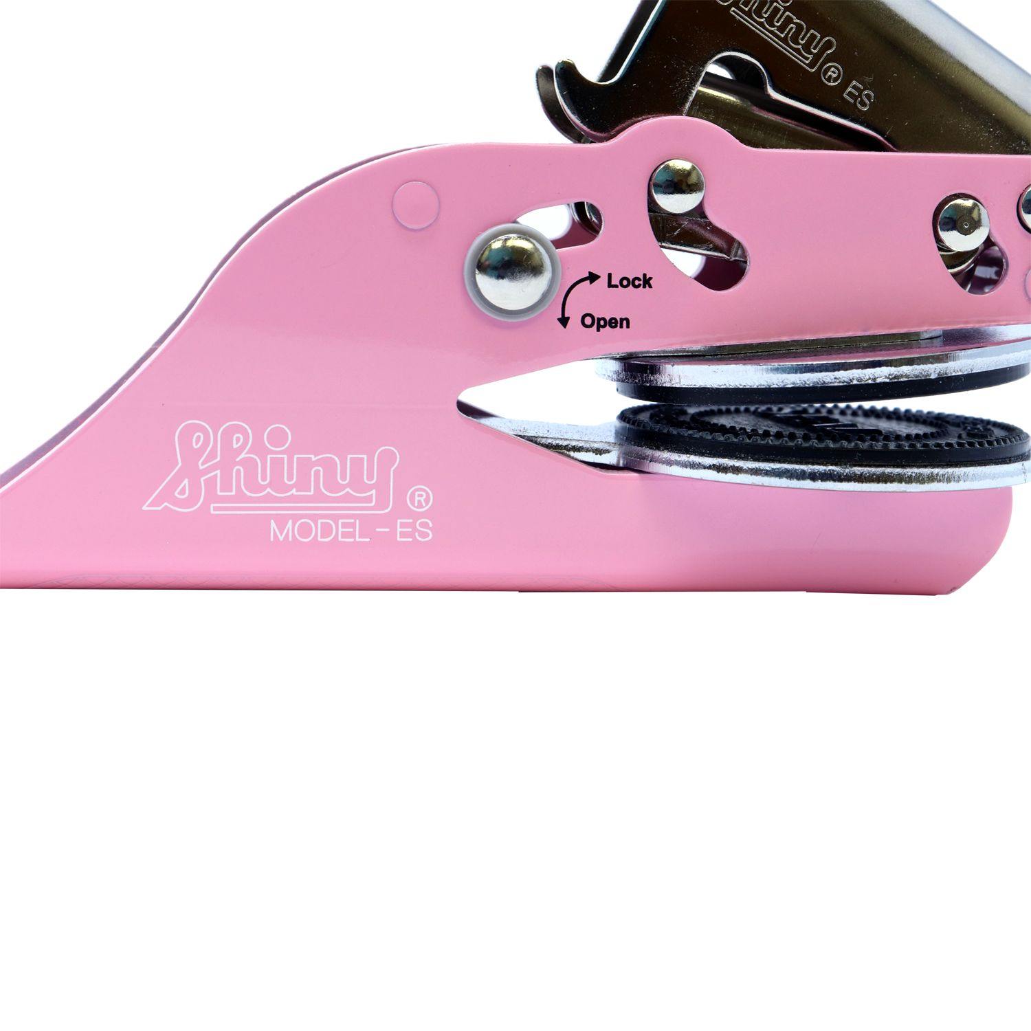 Close-up of the Land Surveyor Pink Soft Seal Embosser in an unlocked position, showing the Shiny Model ES branding and lock mechanism.