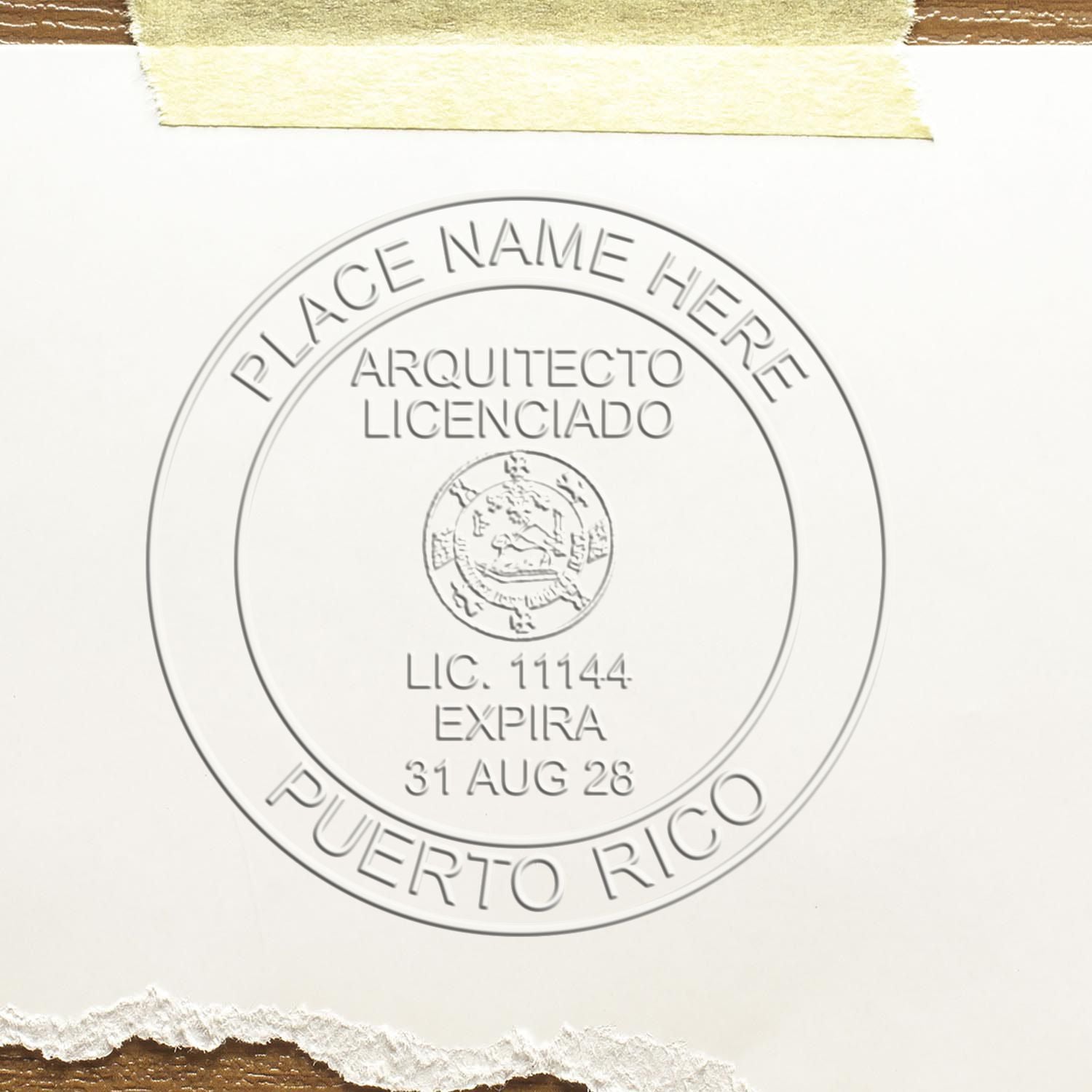 A lifestyle photo showing a stamped image of the Puerto Rico Desk Architect Embossing Seal on a piece of paper