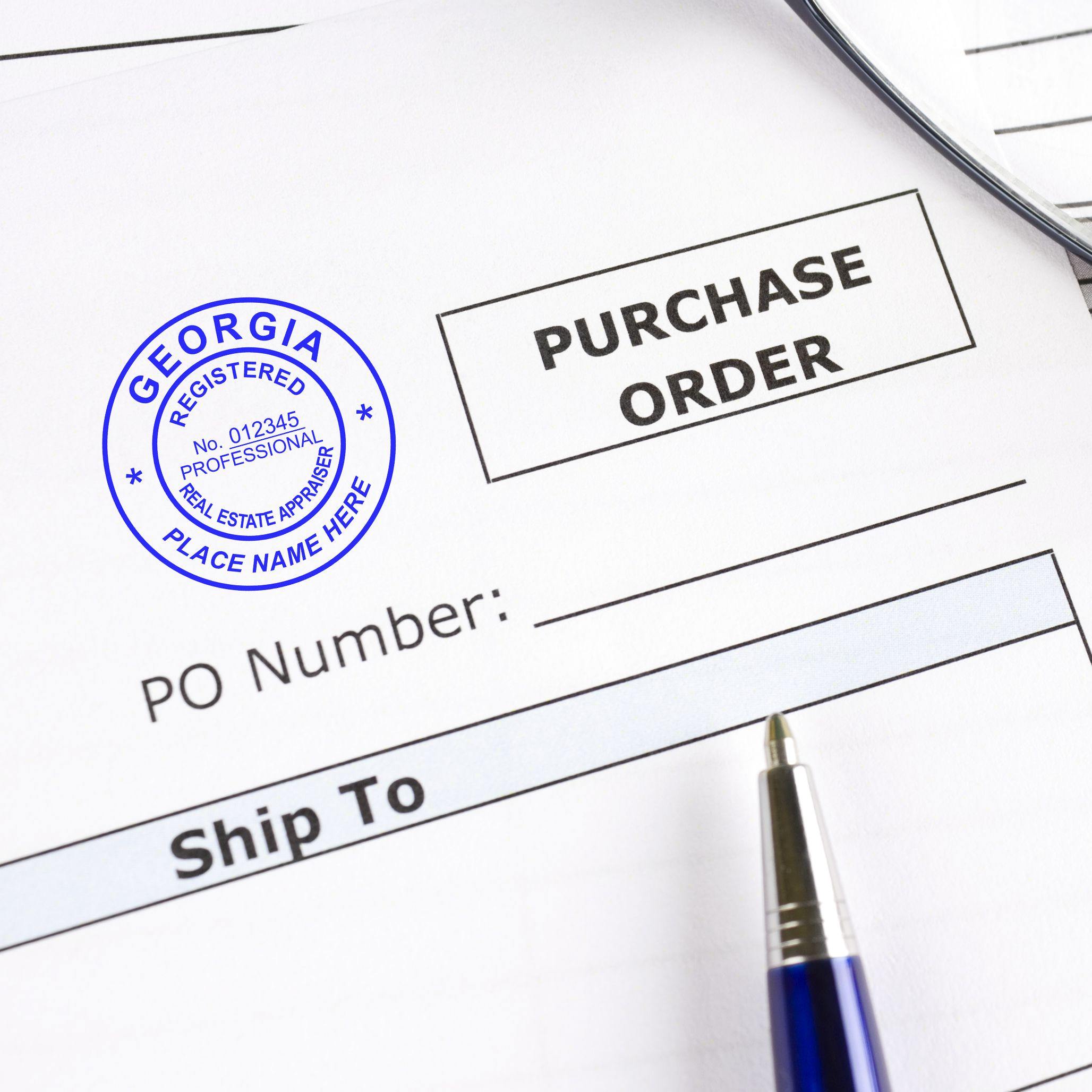 Image of a purchase order stamped with the Real Estate Appraiser Regular Rubber Stamp of Seal in blue ink, next to a pen.