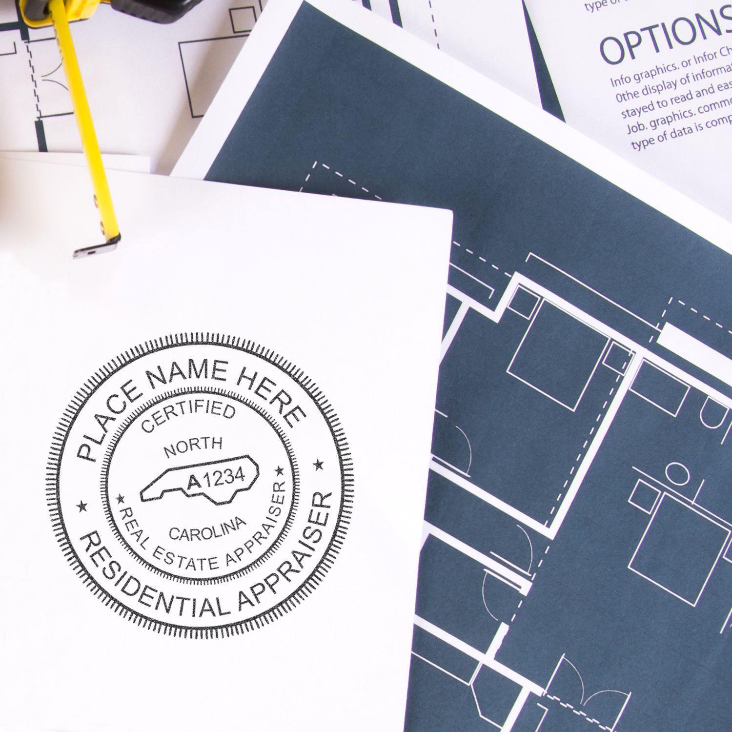 Real Estate Appraiser Regular Rubber Stamp of Seal in use on a document with architectural blueprints in the background.