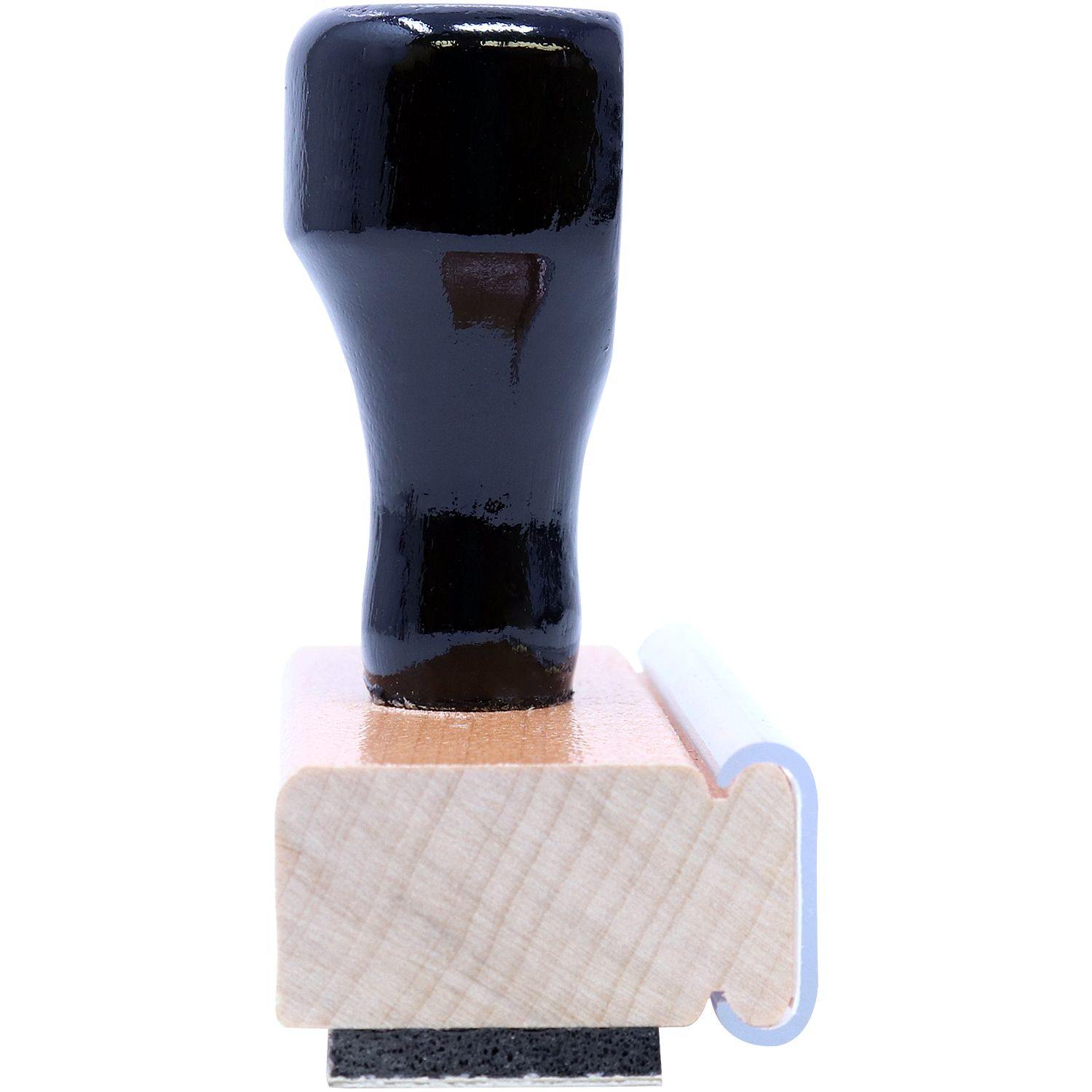 Side view of the Large Bold X-Rays Rubber Stamp with a black handle and wooden base, showcasing the stamp mount and rubber imprint surface.