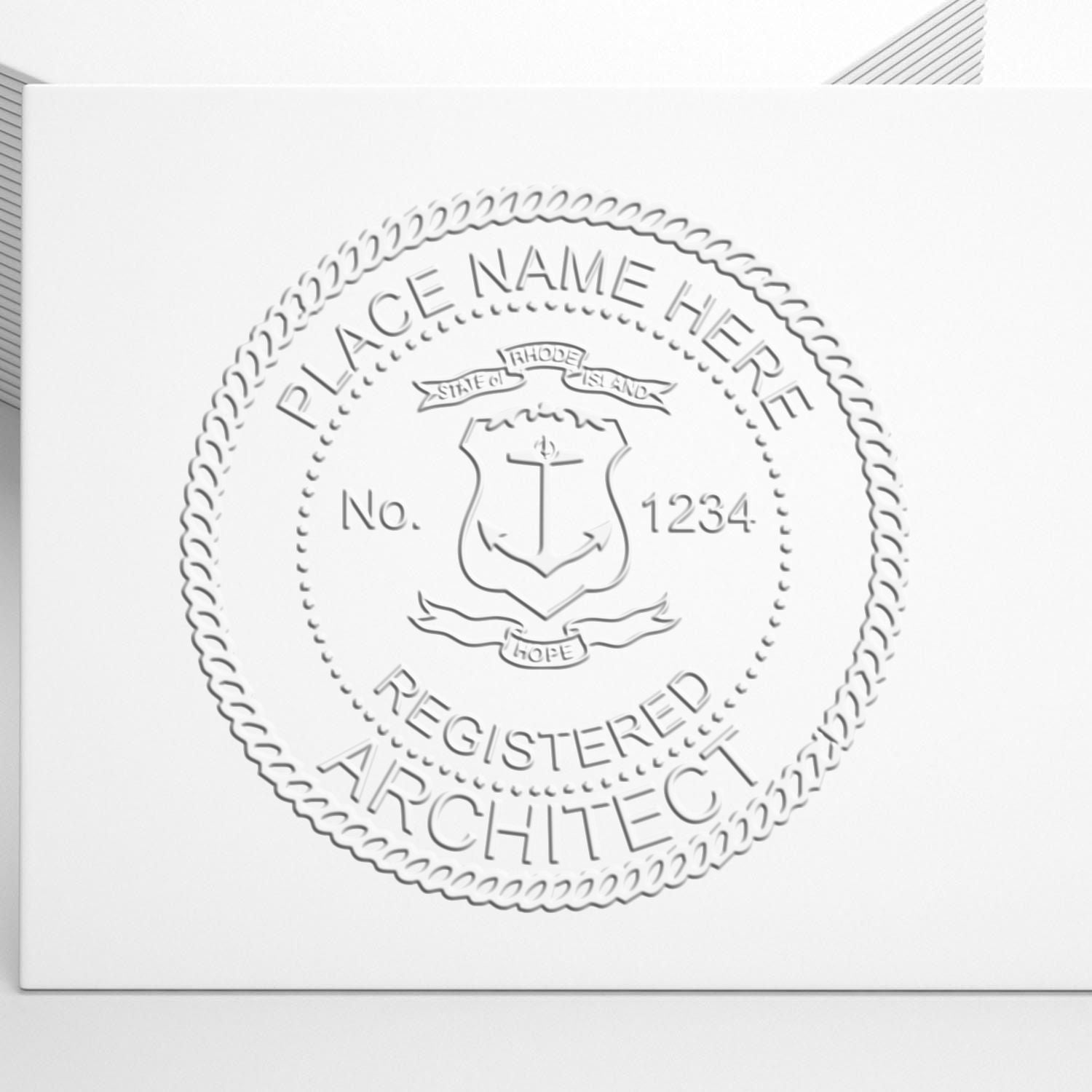 A stamped impression of the Handheld Rhode Island Architect Seal Embosser in this stylish lifestyle photo, setting the tone for a unique and personalized product.