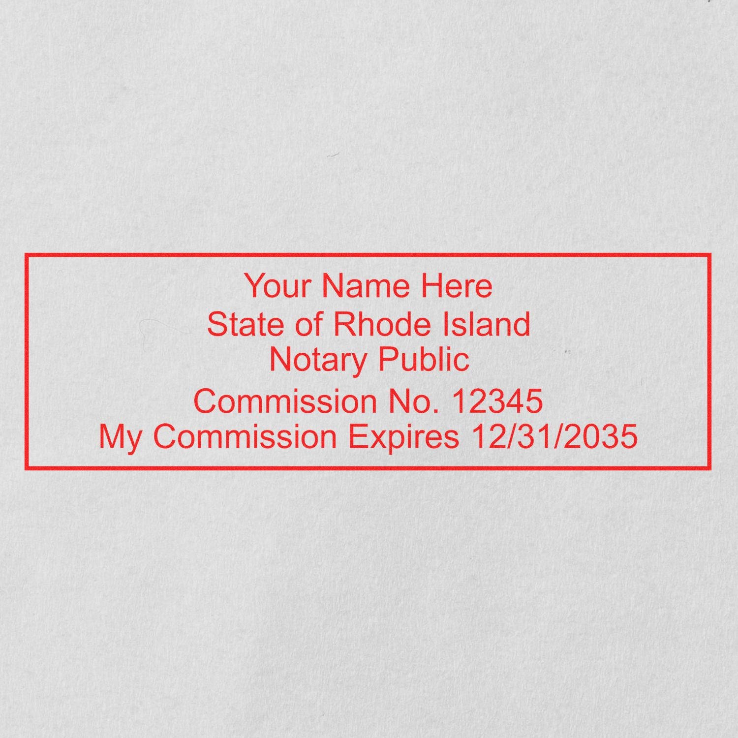 An alternative view of the Slim Pre-Inked Rectangular Notary Stamp for Rhode Island stamped on a sheet of paper showing the image in use