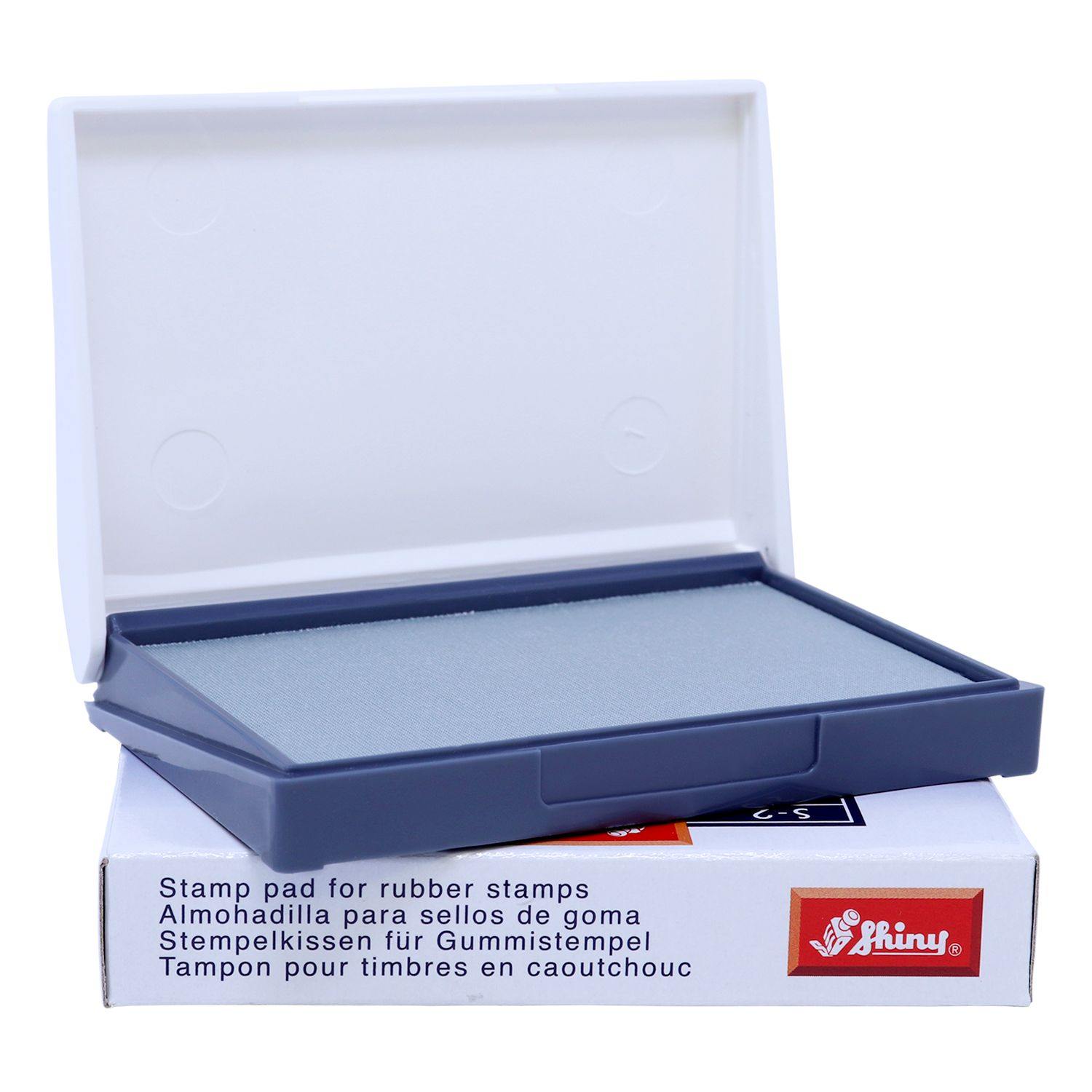 Rubber Stamp Ink Pad 0 Size 2-1/4 x 3-1/2, open with a gray pad inside, placed on a white box with multilingual text and a red Shiny logo.