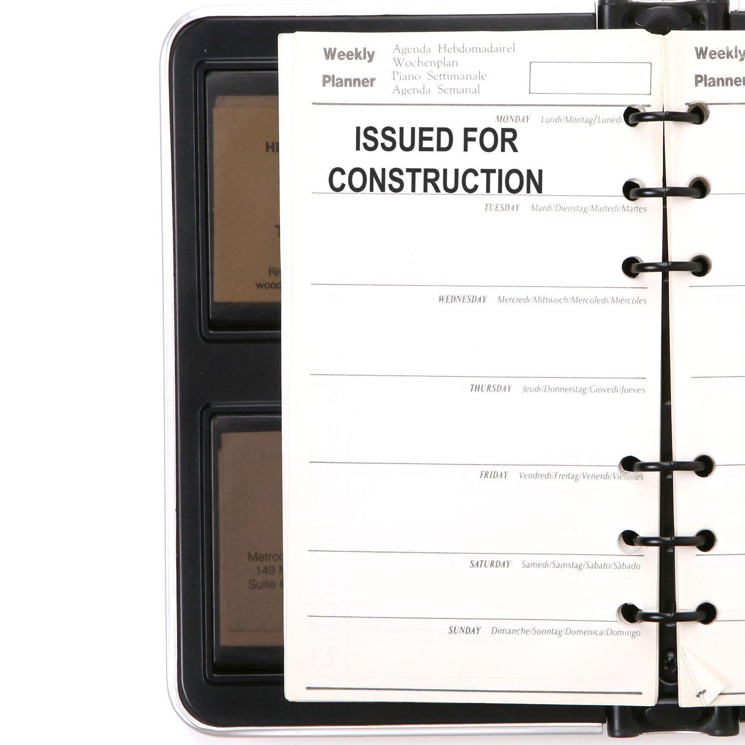 Slim Pre-Inked Issued for Construction Stamp used on a weekly planner page, highlighting the text ISSUED FOR CONSTRUCTION.