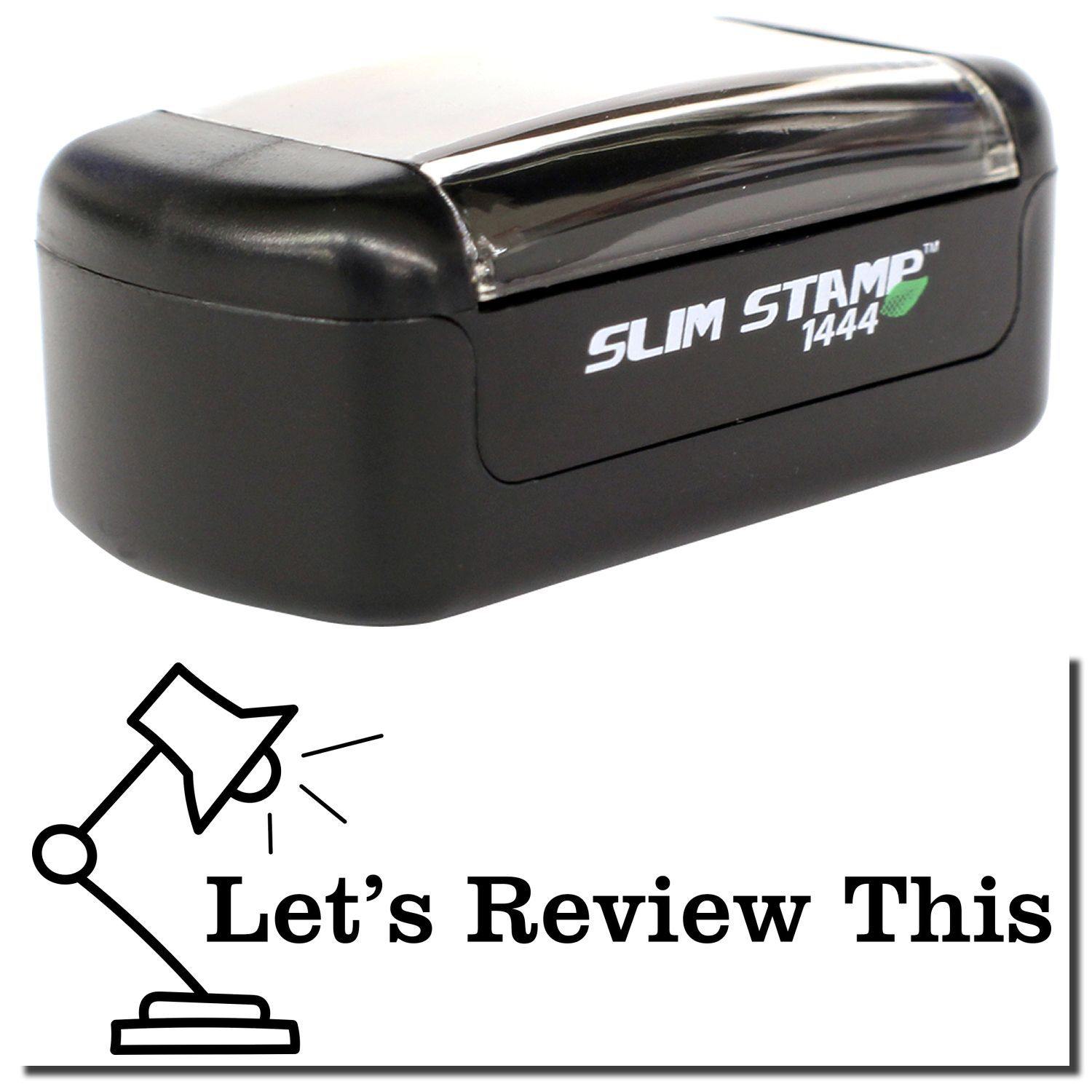 A stock office pre-inked stamp with a stamped image showing how the text LET'S REVIEW THIS with a lamp image on the left side is displayed after stamping.