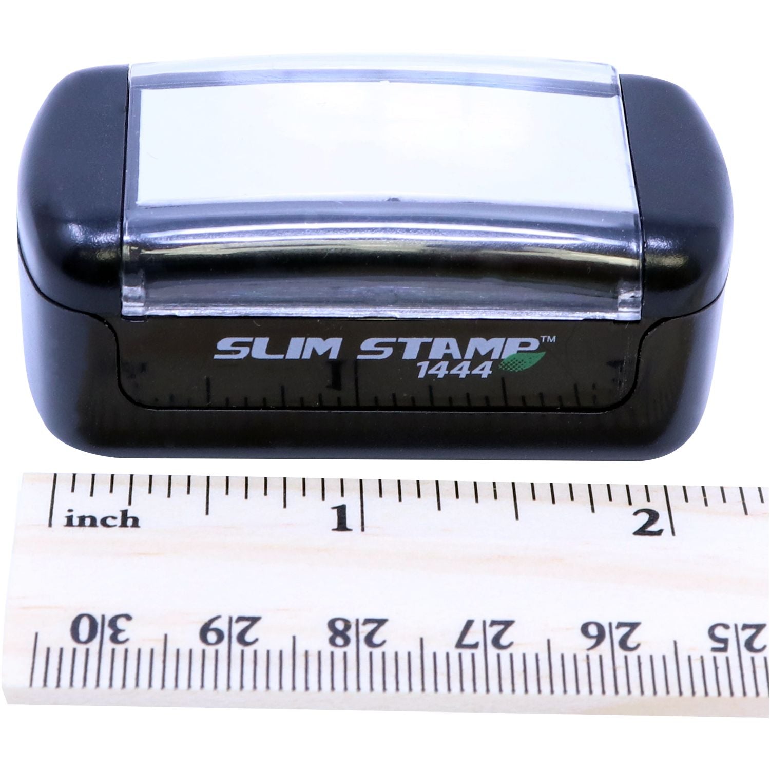 Slim Stamp 1444 Customized Pre-Inked Stamp 1/2 x 1-3/4 shown with a ruler for scale, highlighting its compact size.