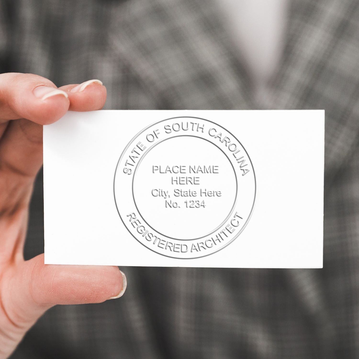 This paper is stamped with a sample imprint of the Handheld South Carolina Architect Seal Embosser, signifying its quality and reliability.