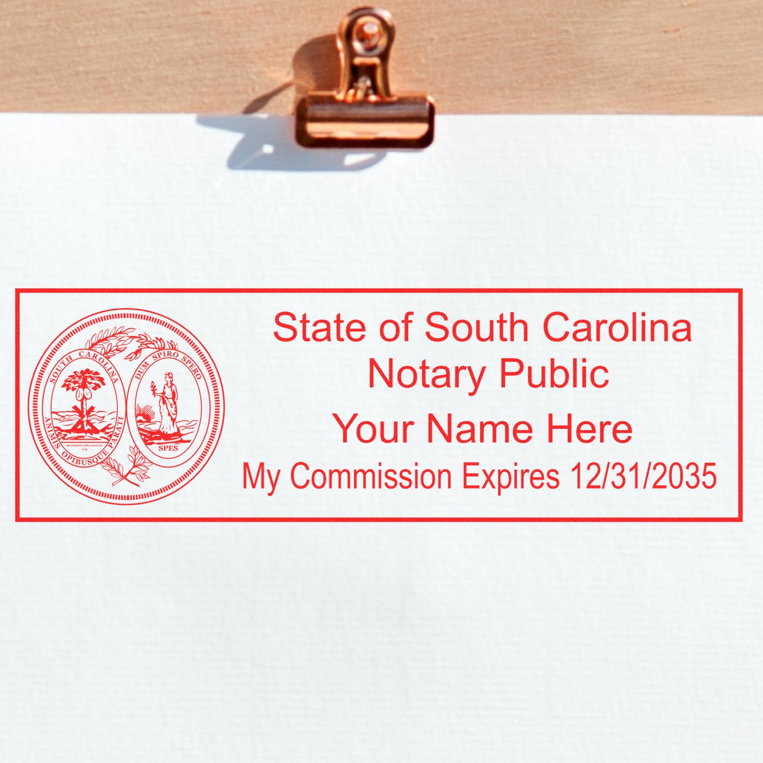 An alternative view of the Slim Pre-Inked State Seal Notary Stamp for South Carolina stamped on a sheet of paper showing the image in use