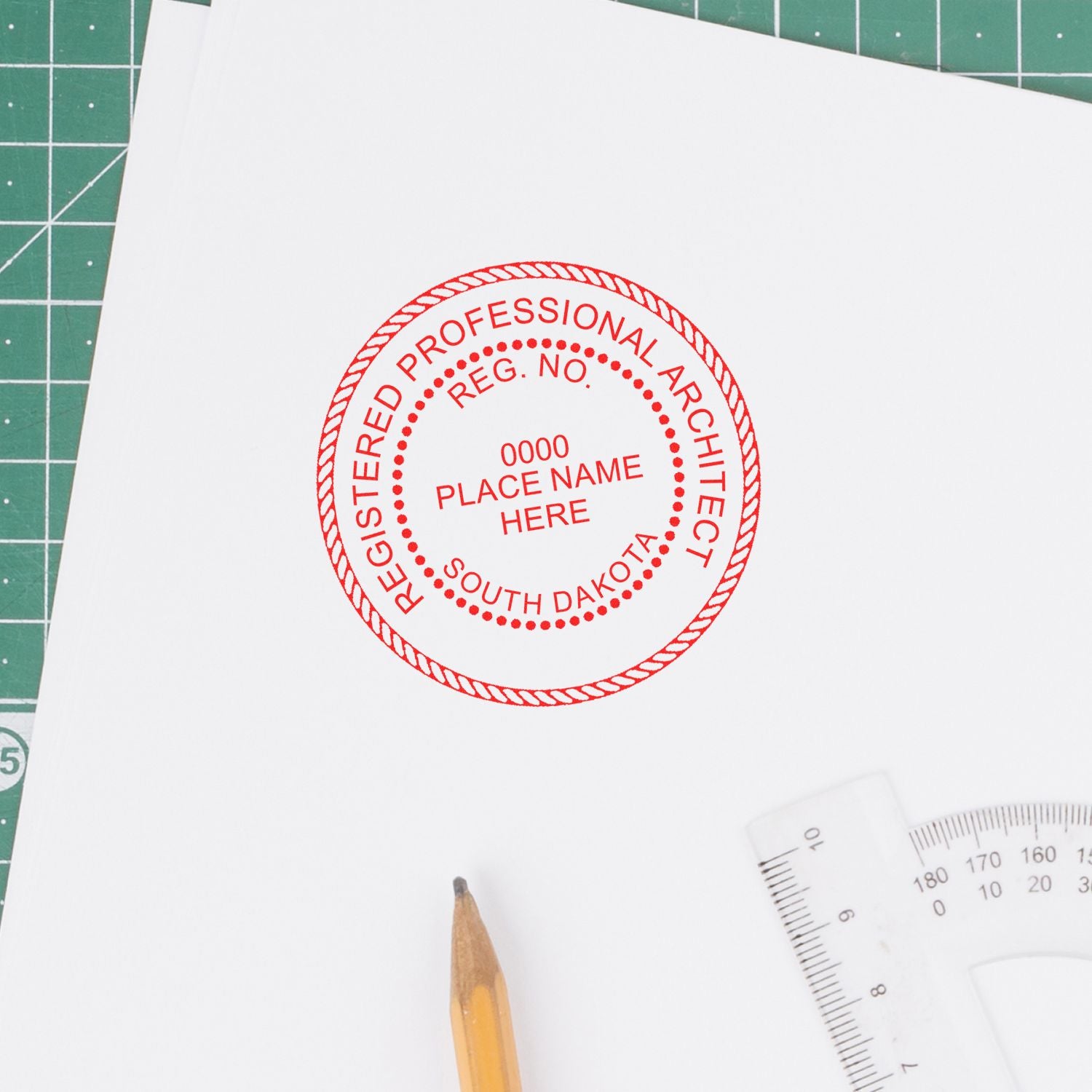 Self Inking South Dakota Architect Stamp in use on white paper, showing a red circular seal with Registered Professional Architect text.