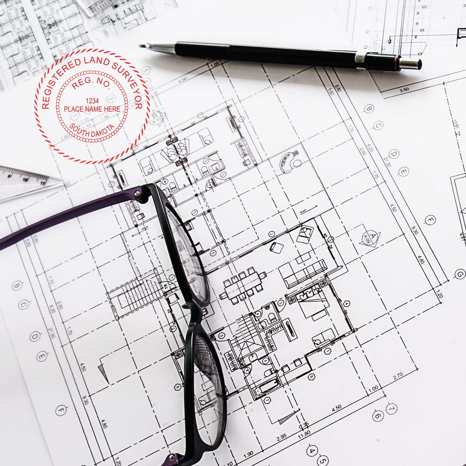 Digital South Dakota Land Surveyor Stamp, Electronic Seal for South Dakota Land Surveyor on architectural blueprints with glasses and pen.