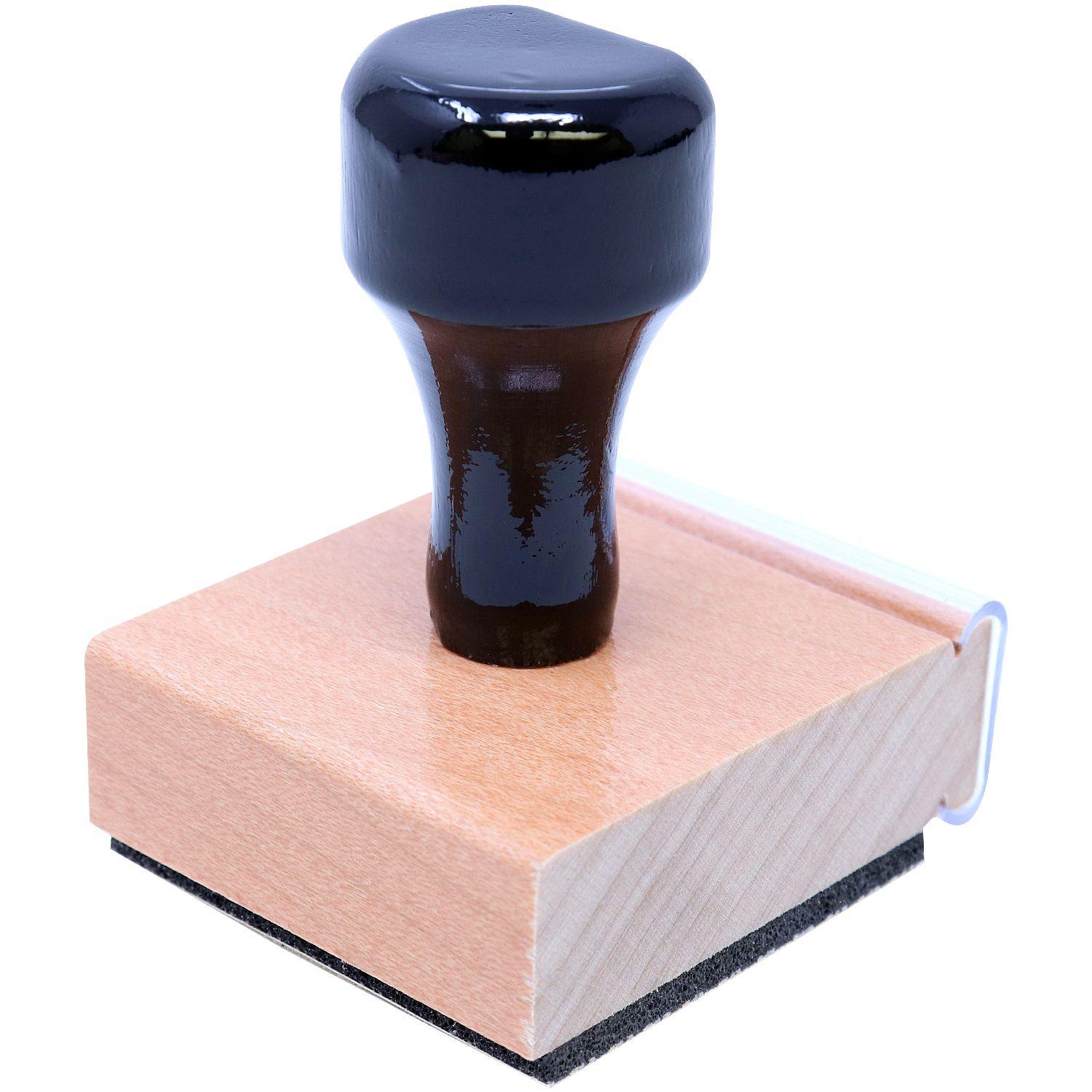 Real Estate Appraiser Regular Rubber Stamp of Seal with a black handle and wooden base, angled side view showing the stamp pad.