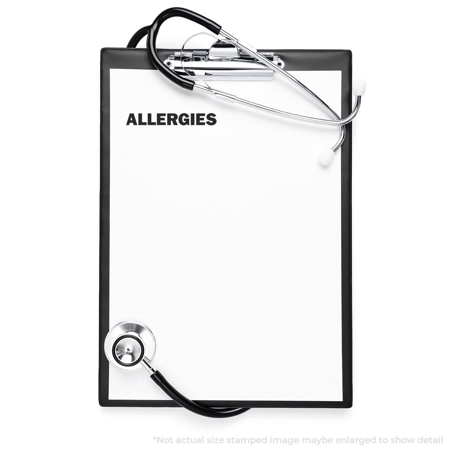 Clipboard with stethoscope and Large Allergies Rubber Stamp imprint on paper, indicating medical allergies.