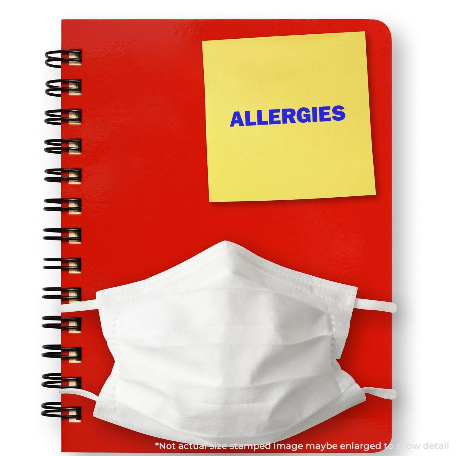 Red notebook with a white mask and a yellow sticky note stamped with ALLERGIES using the Large Allergies Rubber Stamp.