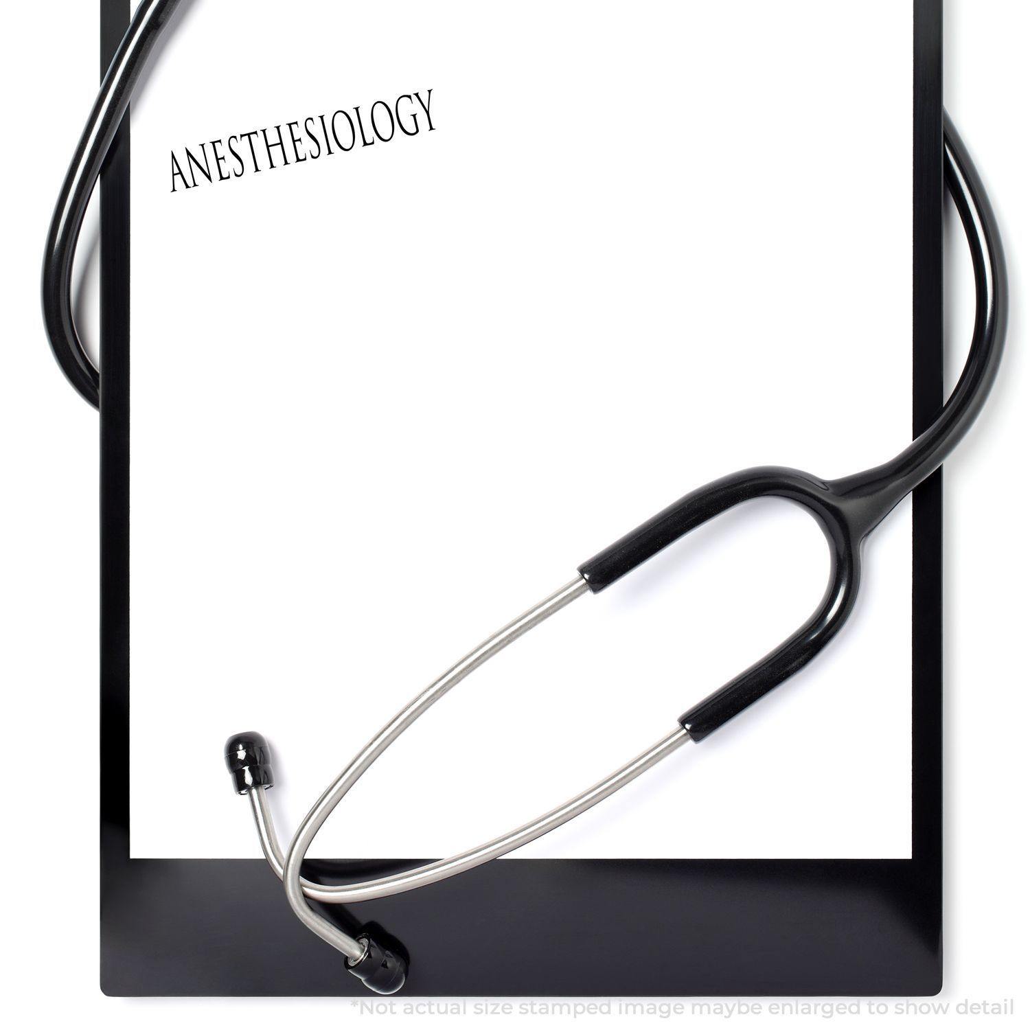 A clipboard with a stethoscope and a stamped paper reading Anesthesiology using the Large Anesthesiology Rubber Stamp.