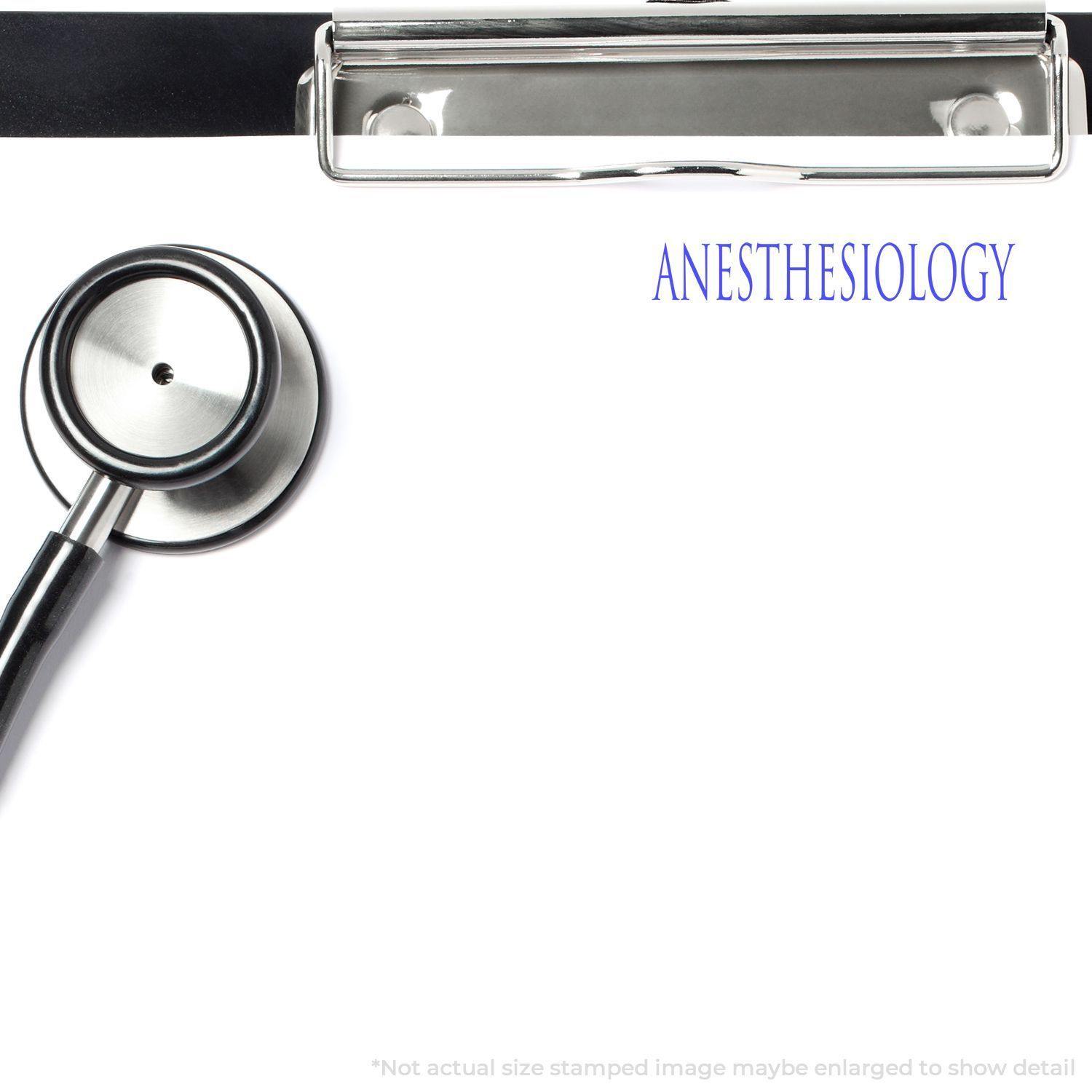 Self Inking Amortizado Stamp in use on a clipboard with a stethoscope, stamping ANESTHESIOLOGY on a white sheet of paper.