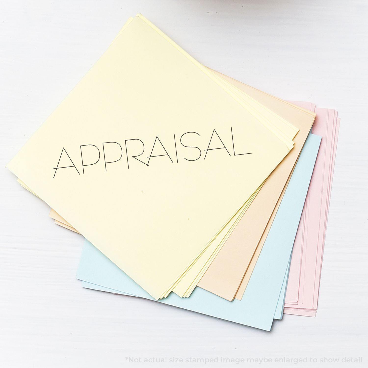 Stack of pastel-colored papers with 'APPRAISAL' stamped on top, using an Appraisal Rubber Stamp.