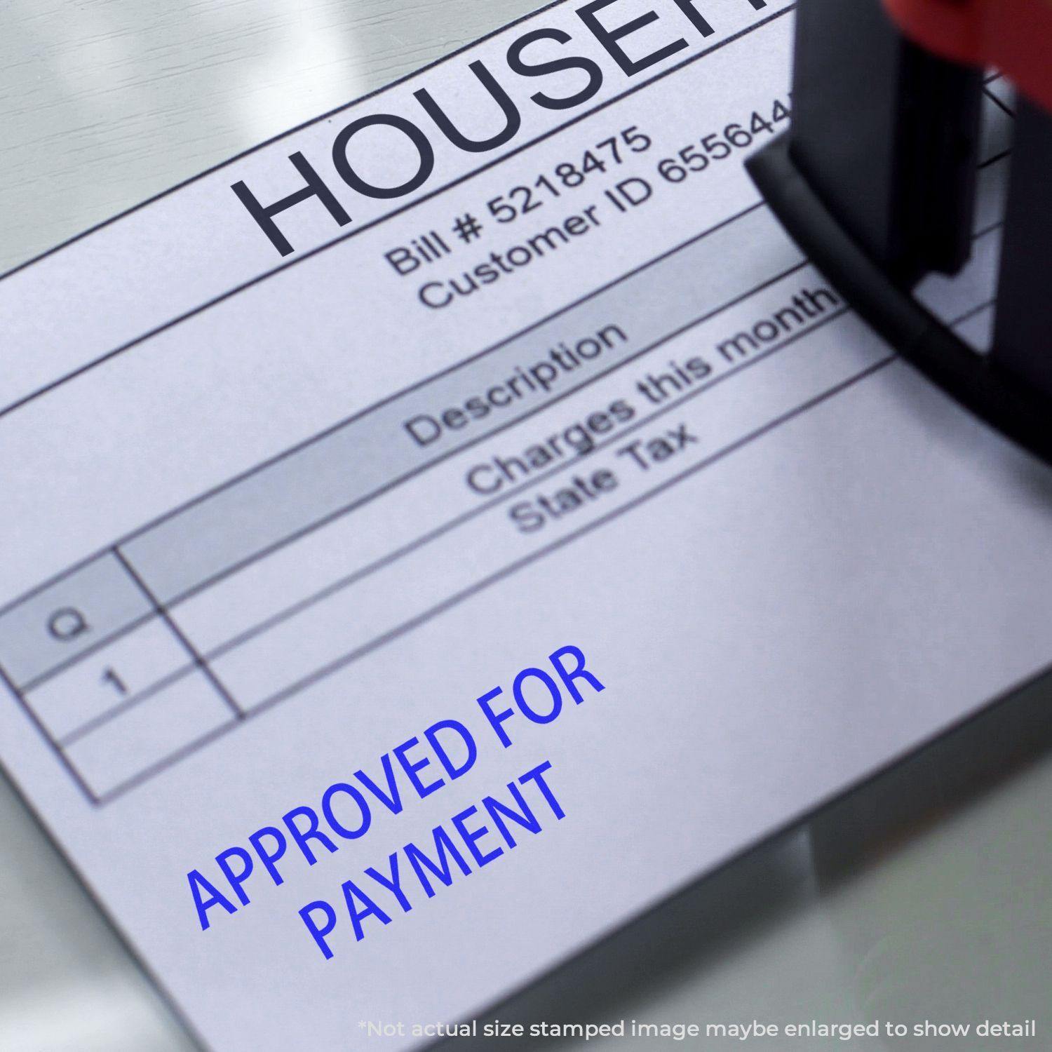 A Self Inking Approved For Payment Stamp marking a document with Approved For Payment in blue ink on a bill with itemized charges.