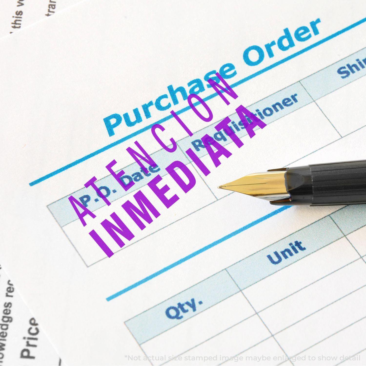 Atencion Inmediata rubber stamp in purple ink on a purchase order form with a pen nearby.