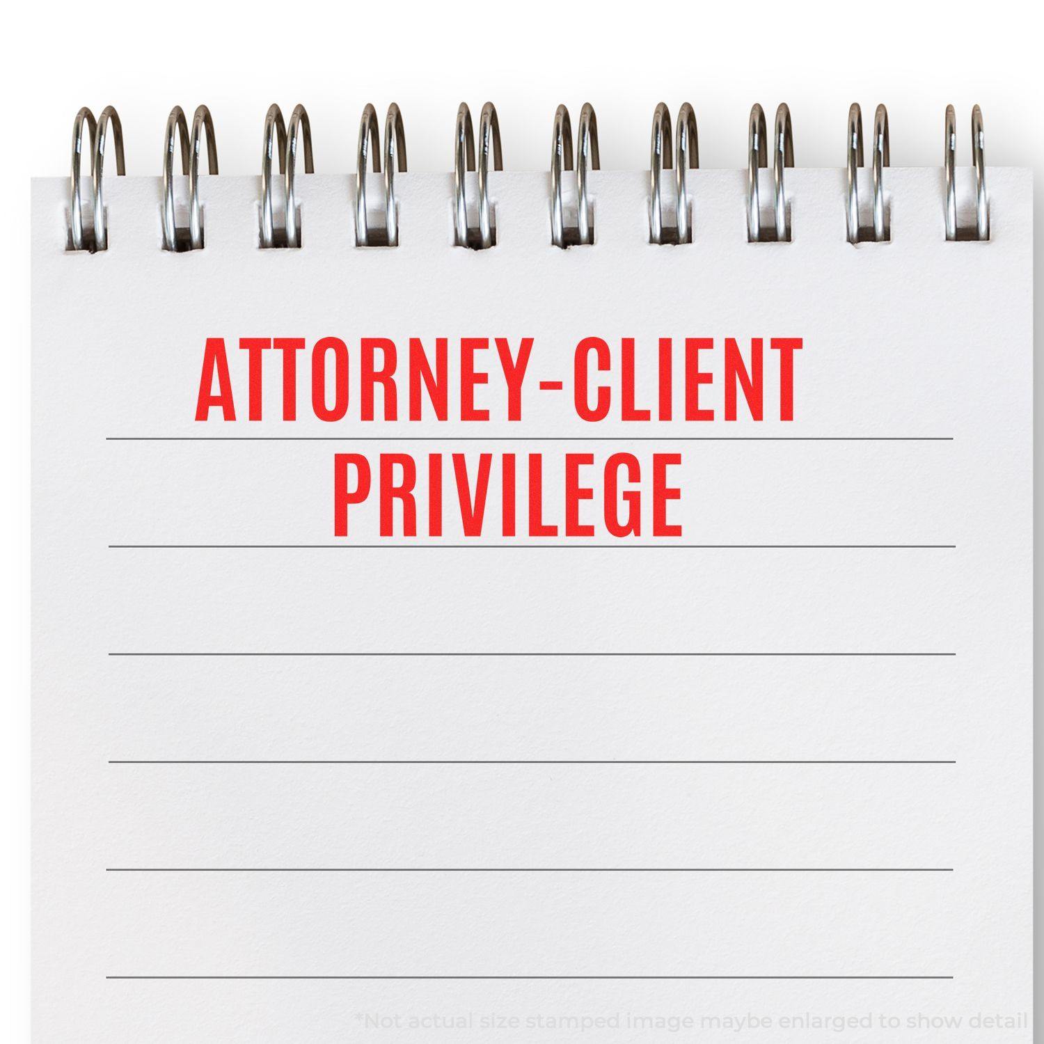 Self Inking Attorney-Client Privilege Stamp used on a spiral notepad, displaying ATTORNEY-CLIENT PRIVILEGE in red ink.