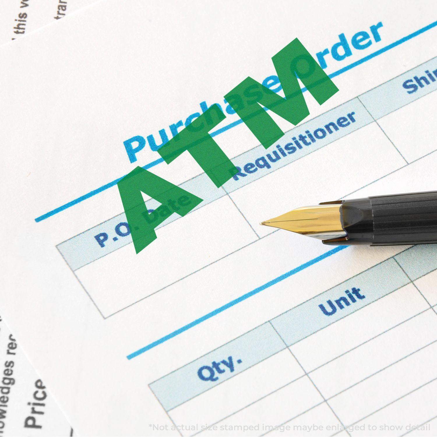 Large Self Inking ATM Stamp marking a purchase order document with a green ATM imprint, next to a black and gold pen.