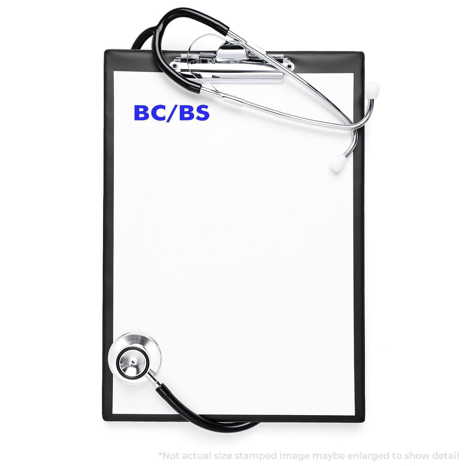 BC/BS Medical Provider Rubber Stamp on a white clipboard with a stethoscope, indicating medical documentation.