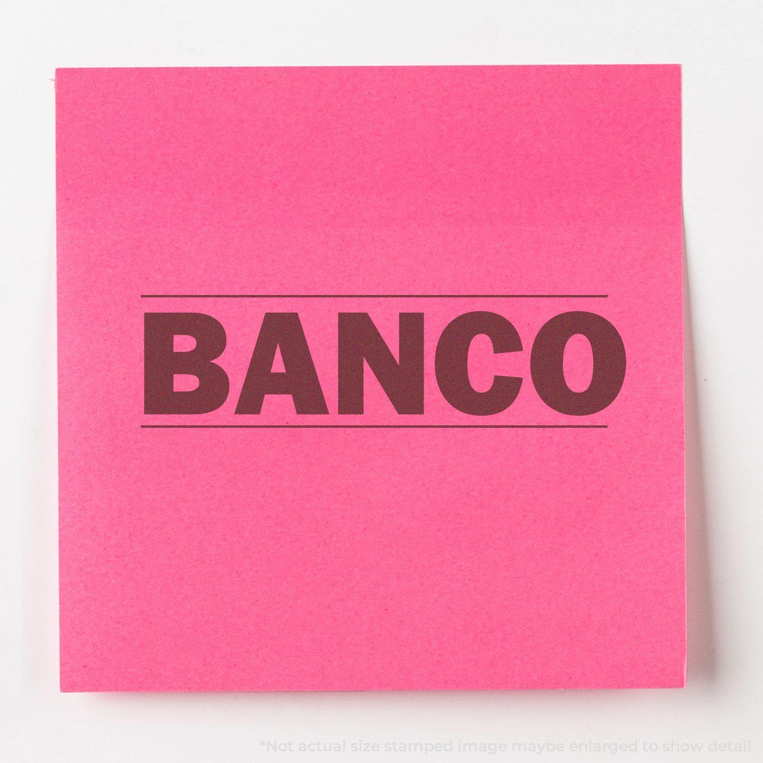 A pink paper with the word BANCO stamped in bold black letters using the Large Pre-Inked Bold Banco Stamp.