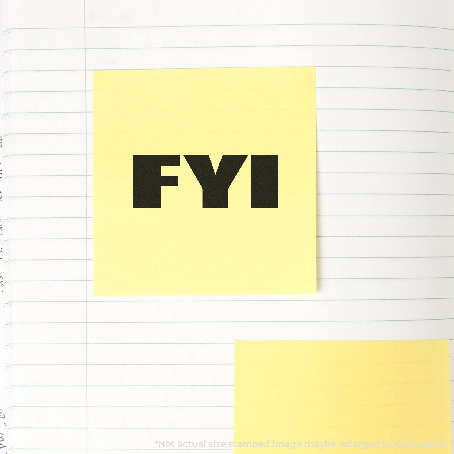 Yellow sticky note stamped with "FYI" using the Bold FYI Rubber Stamp on a lined notebook page.