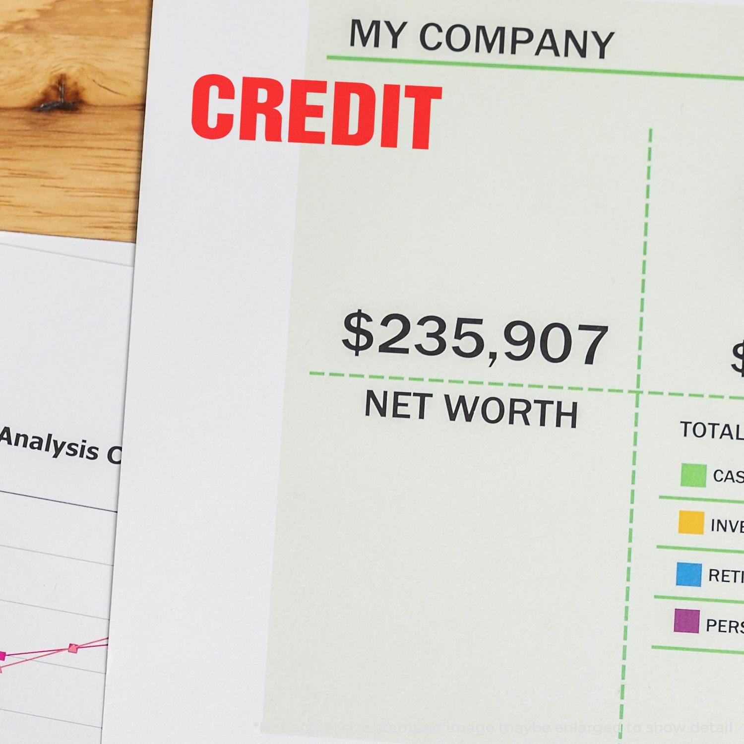 Document stamped with Self Inking Bold Red Credit Stamp, showing CREDIT in red on a financial report with net worth of $235,907.