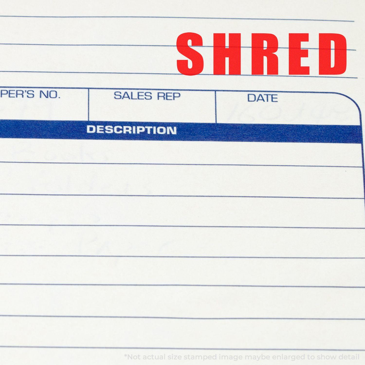 Bold Shred Rubber Stamp used on a document, displaying the word SHRED in red ink on a lined paper form.