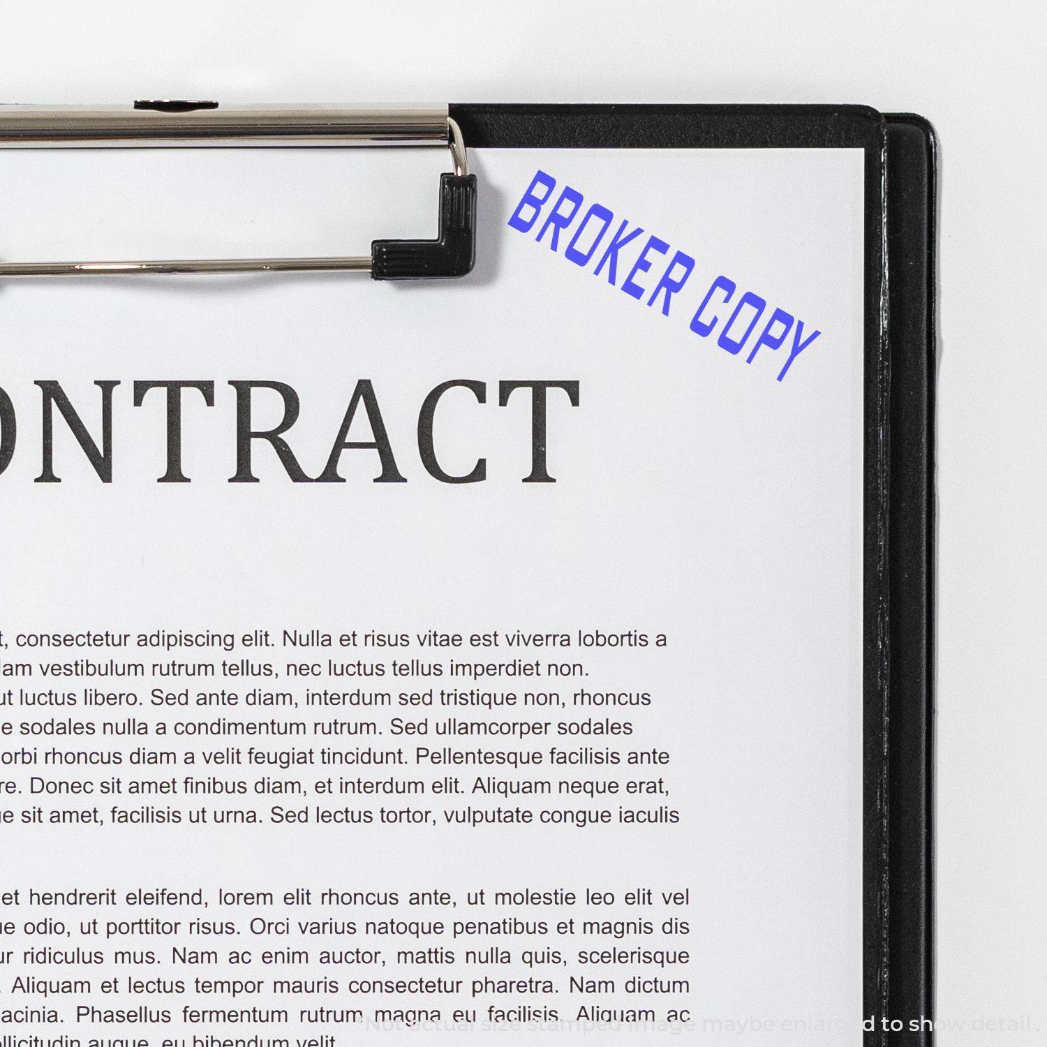 Large Pre-Inked Broker Copy Stamp marking BROKER COPY in blue ink on a contract document clipped to a black clipboard.