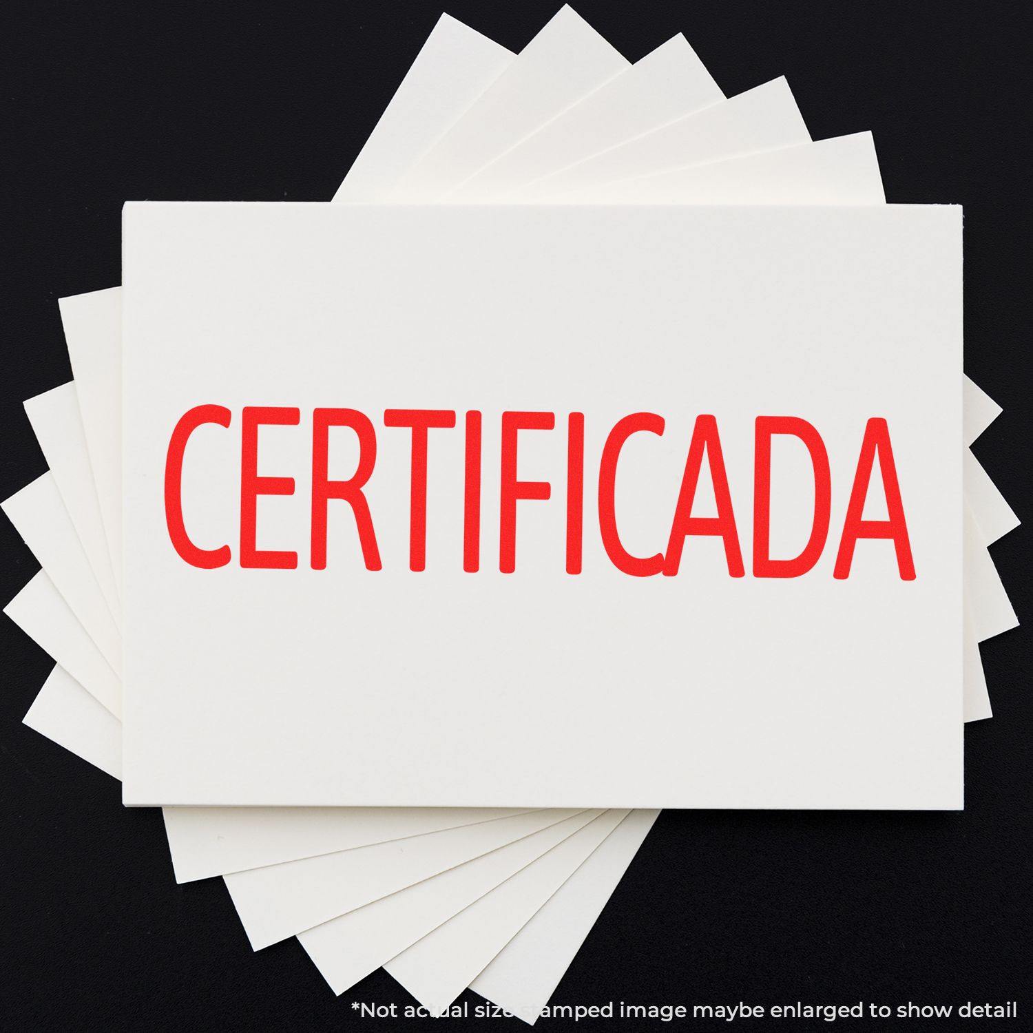 Certificada Rubber Stamp in use, displaying the word CERTIFICADA in bold red letters on a white card, against a black background.